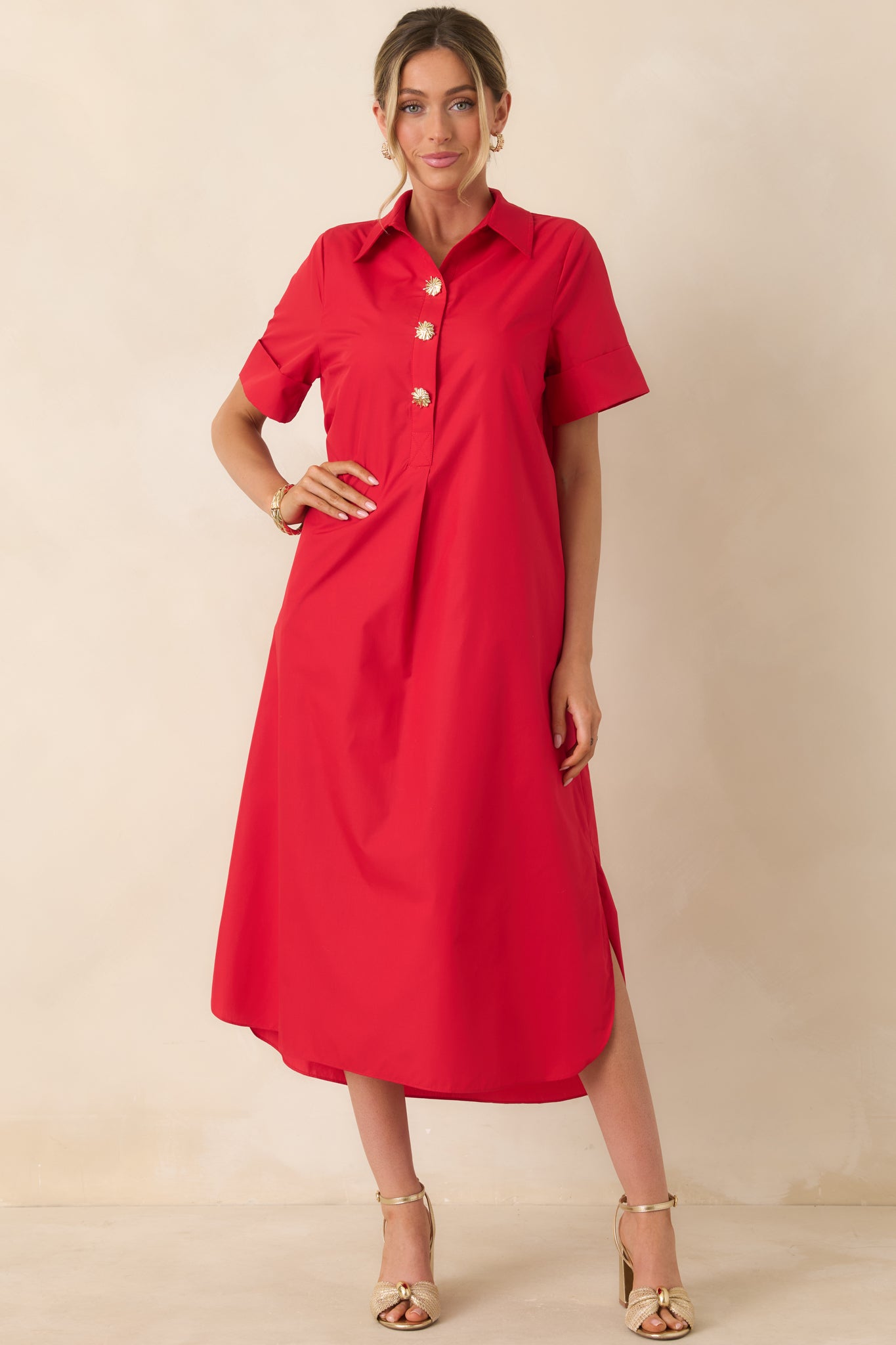 Red maxi dress with polished collar detail and gold snap closures.