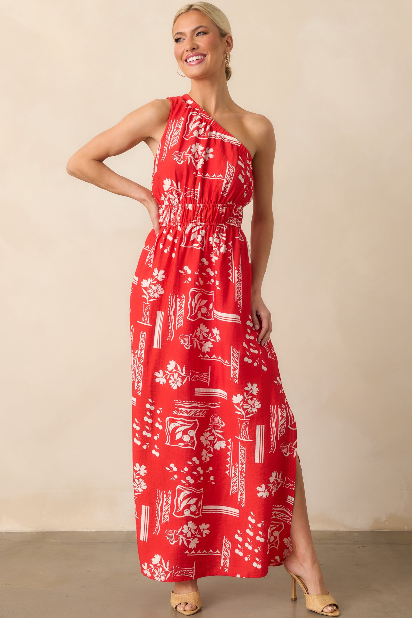 Red maxi dress with white geometric floral print, featuring an elastic waist and side leg slit shown front-facing.