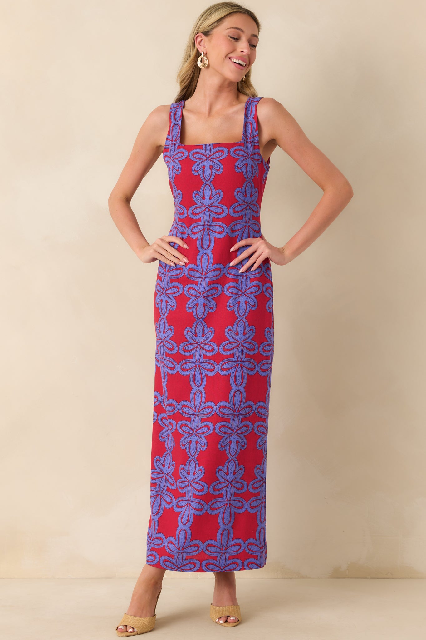 A full body view showcasing the maxi length and the bold geometric pattern throughout the dress.