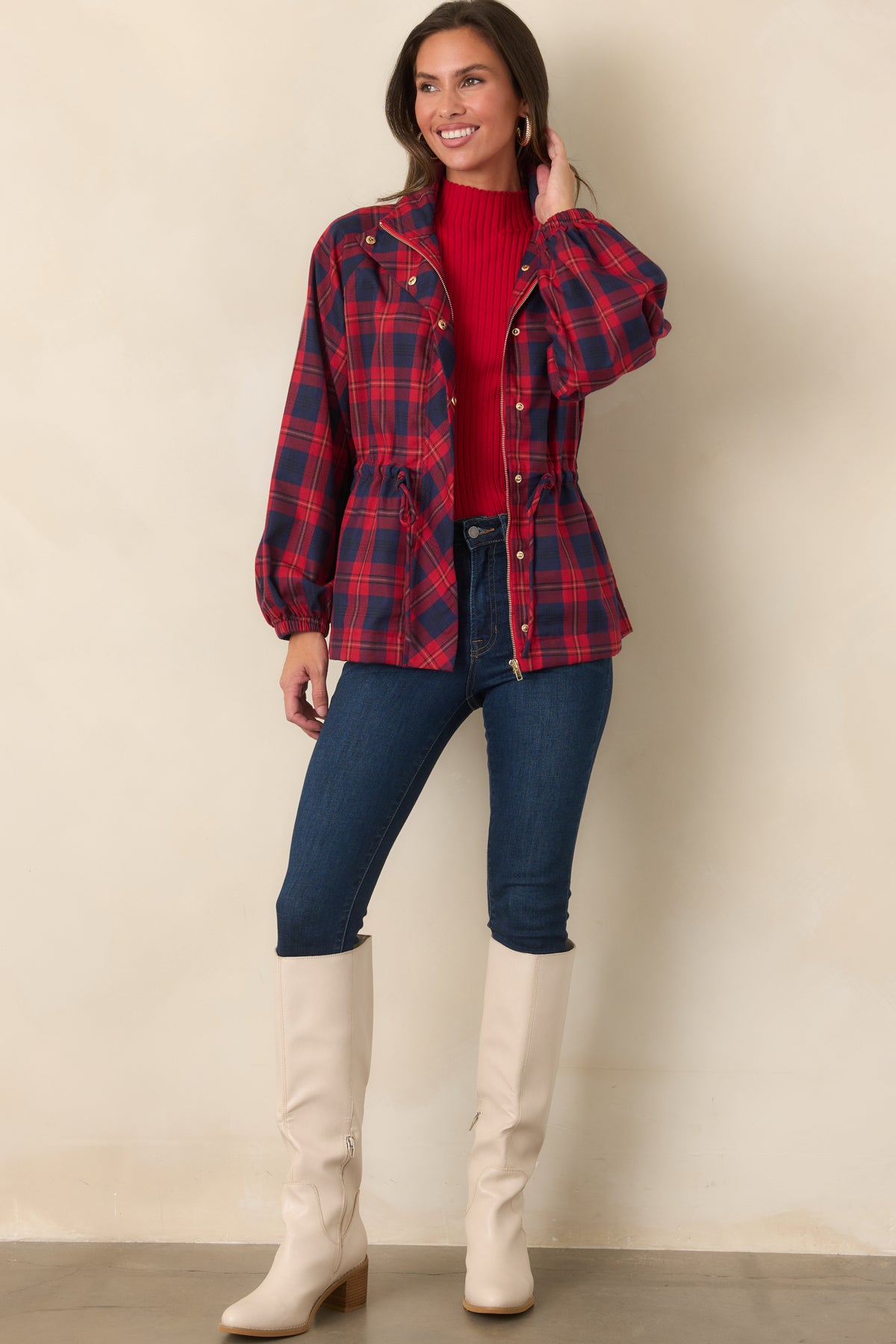 Plaid zip-front jacket with snap accents, a structured collar, elastic cuffs, and a defined drawstring waist.