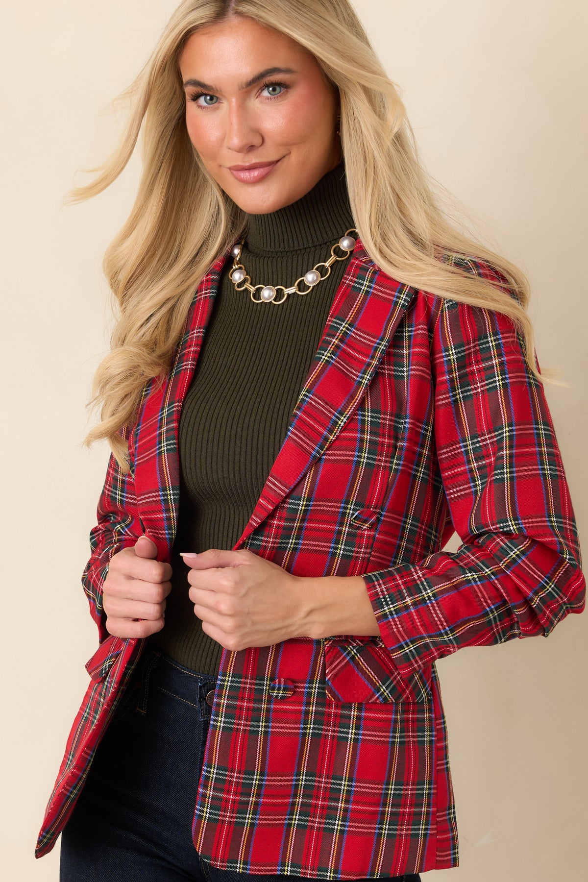 Red plaid blazer front with notched lapels, a button closure, and classic tartan pattern.
