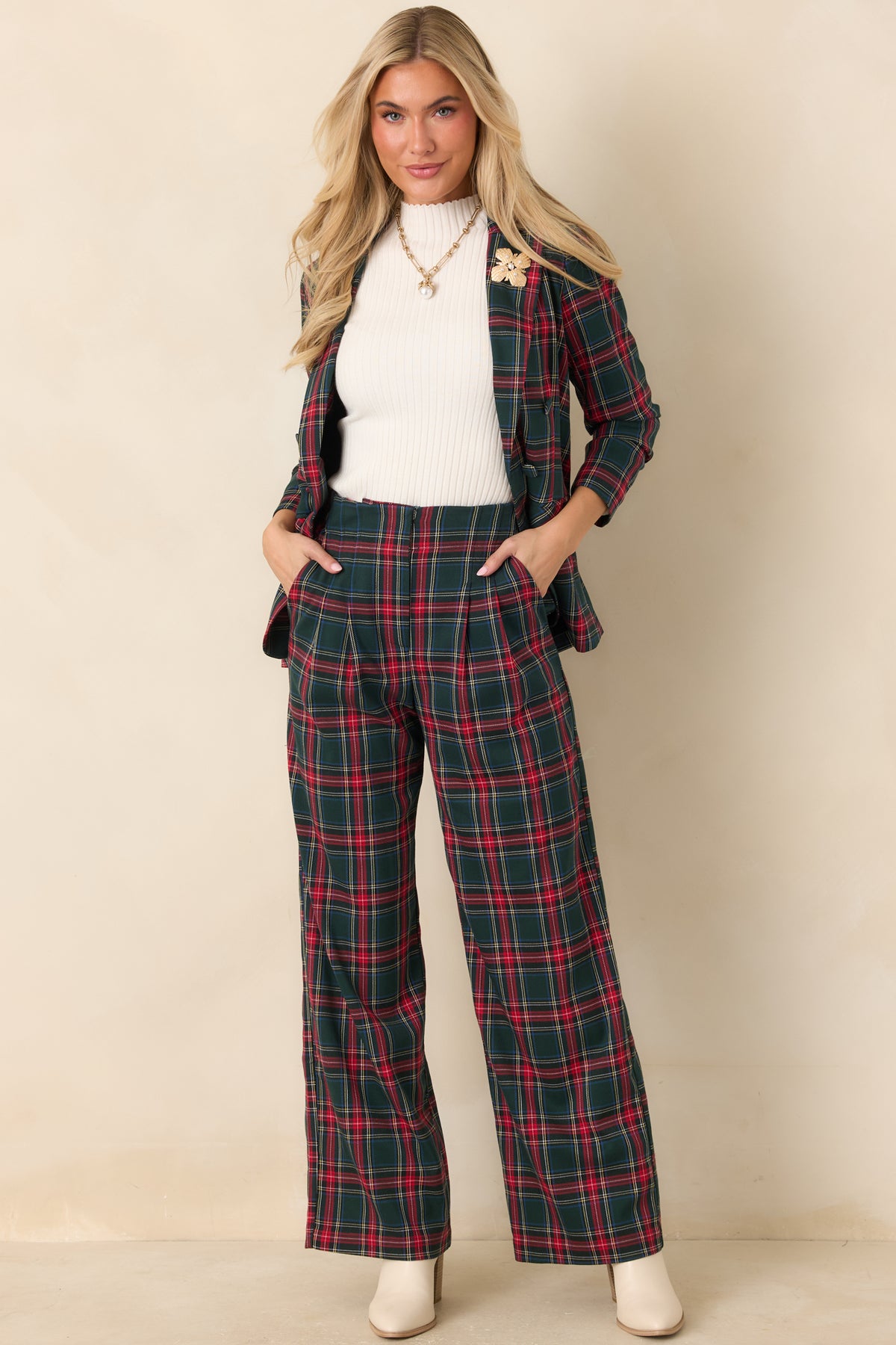 Festive red plaid blazer with front pockets, a classic lapel collar, and softly scrunched sleeves.