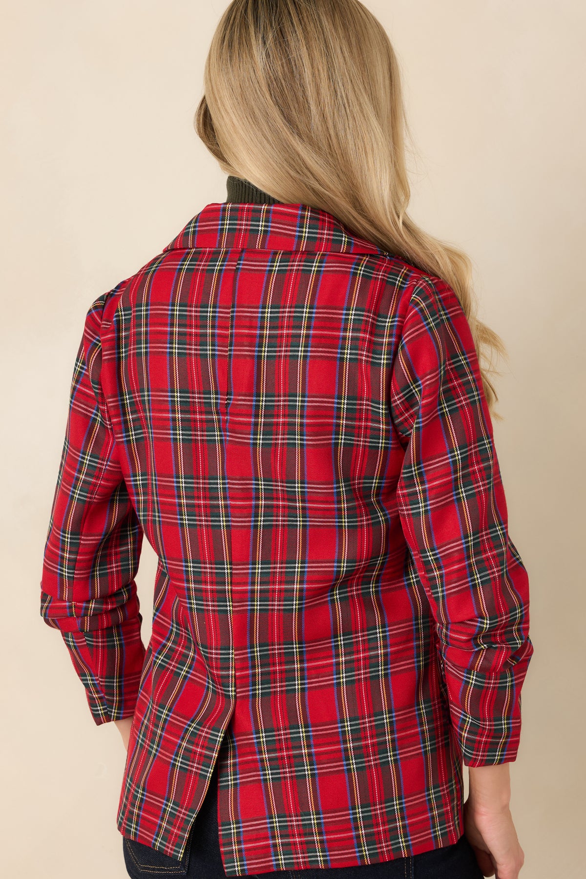 Rear view of the red plaid blazer showing the tailored back seams and center back vent.