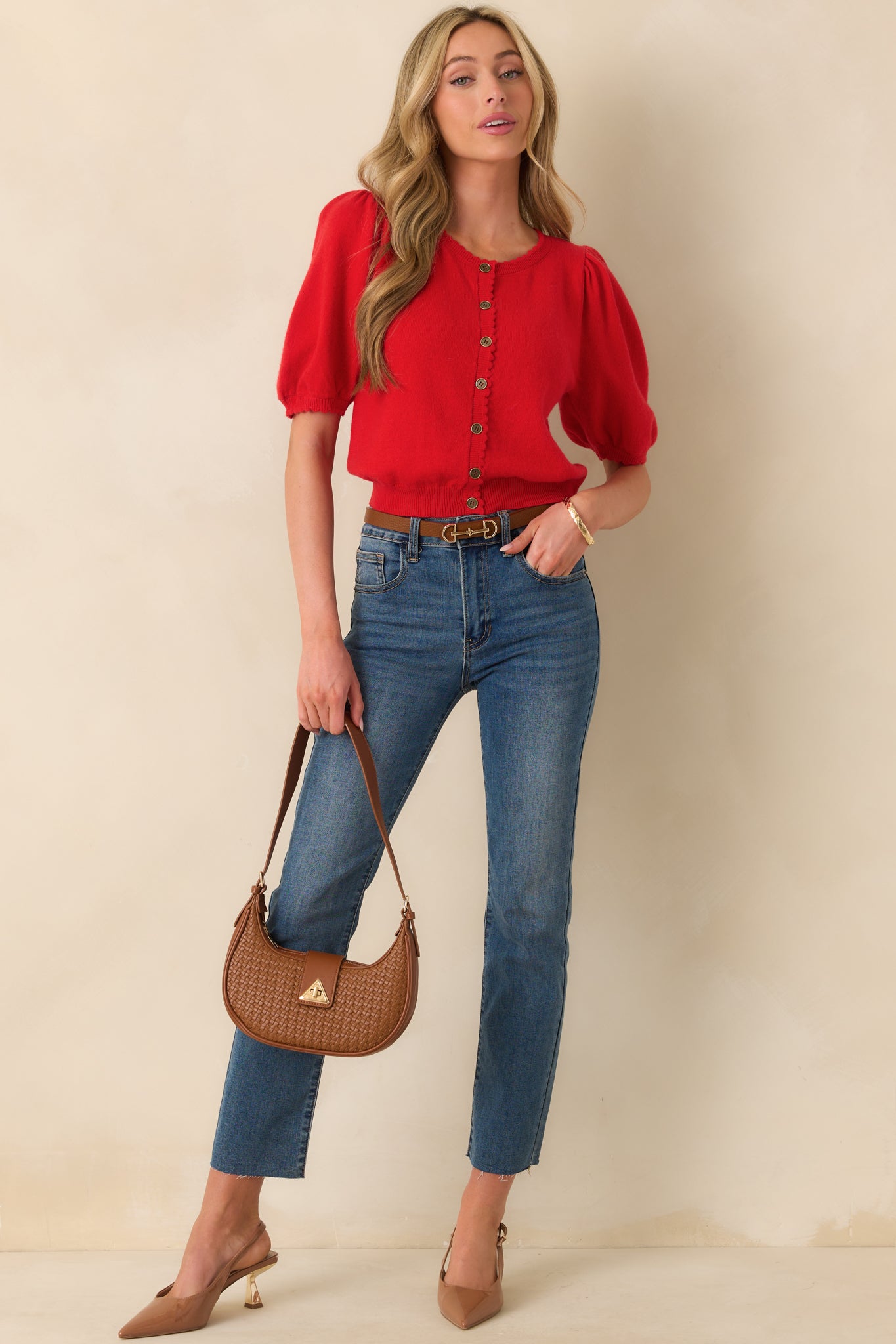 Front-facing full body view of the red cardigan showing the round neckline, short sleeves, and functional button front.