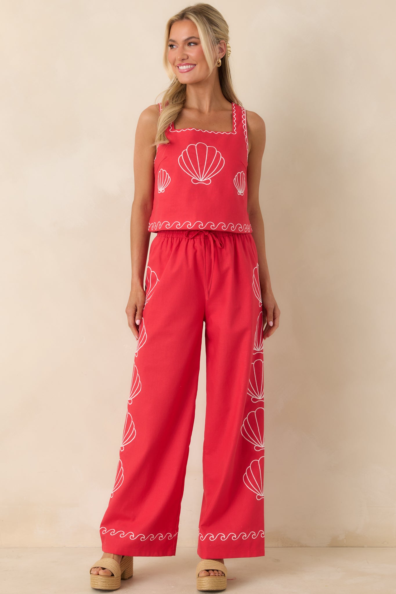 Red tank top with square neckline and contrast scalloped trim detail.