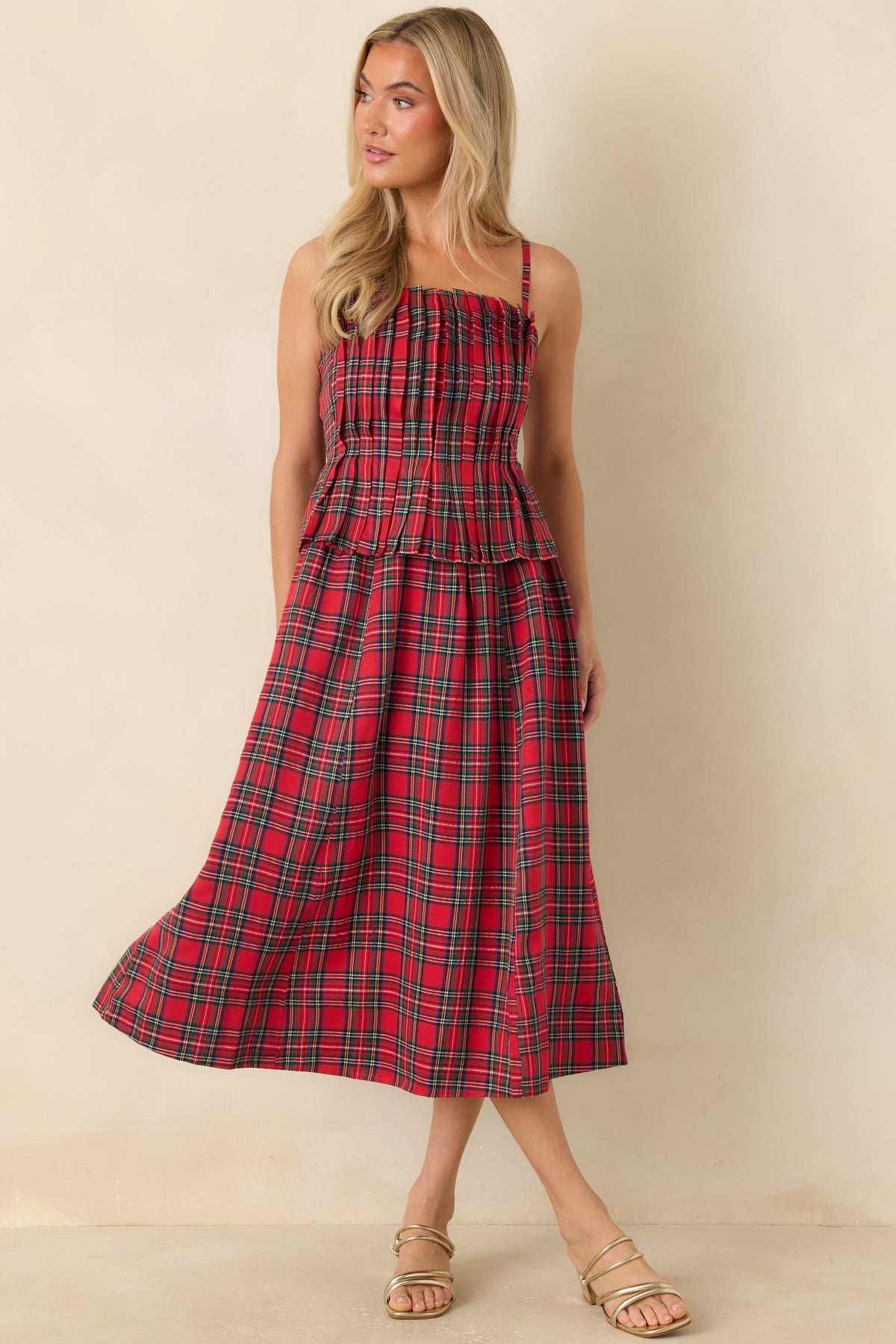 Red tartan midi dress with a softly ruffled neckline and gently flared skirt.