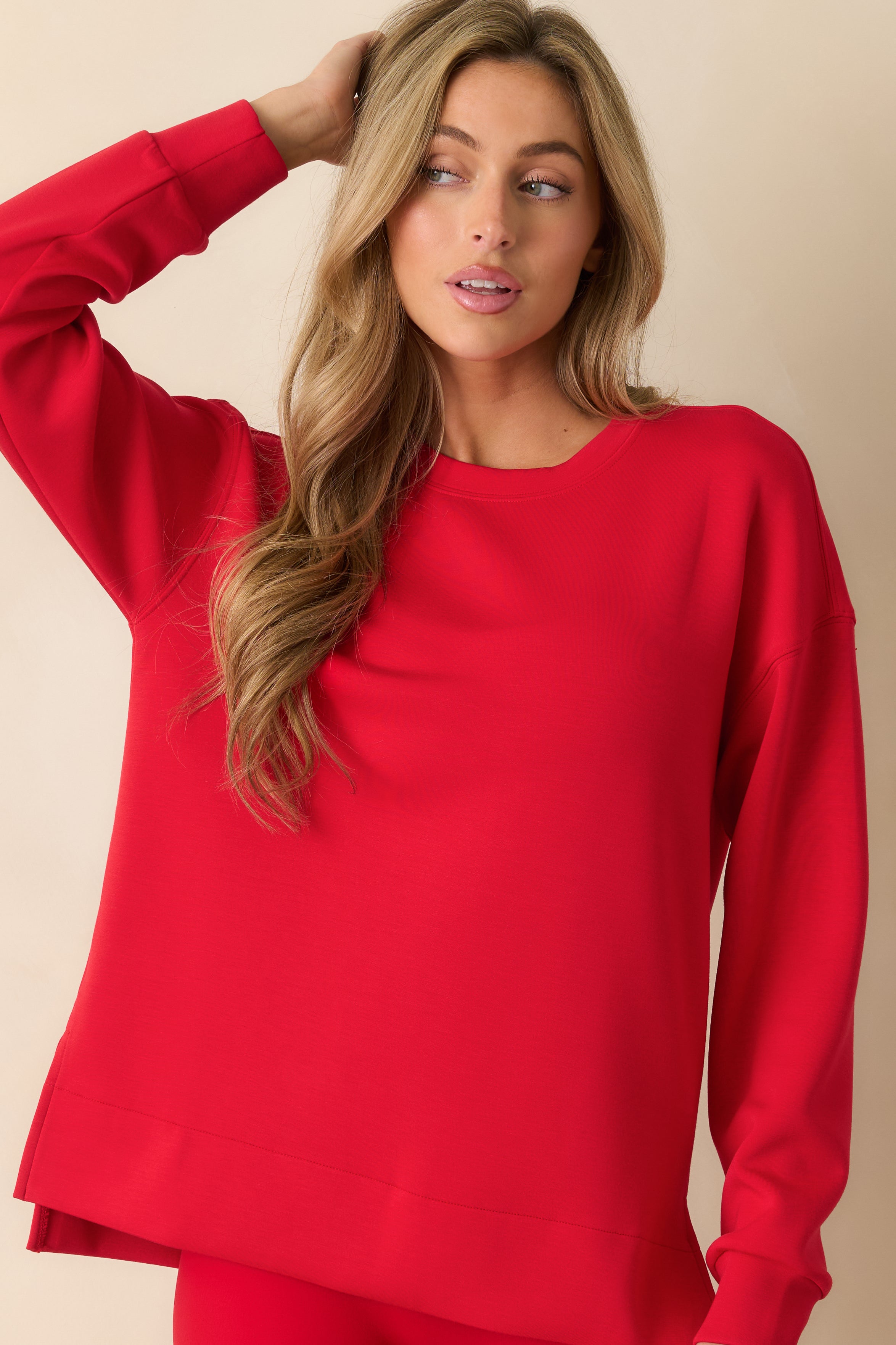 Front view of the red tunic highlighting its breathable material and casual, comfortable silhouette.