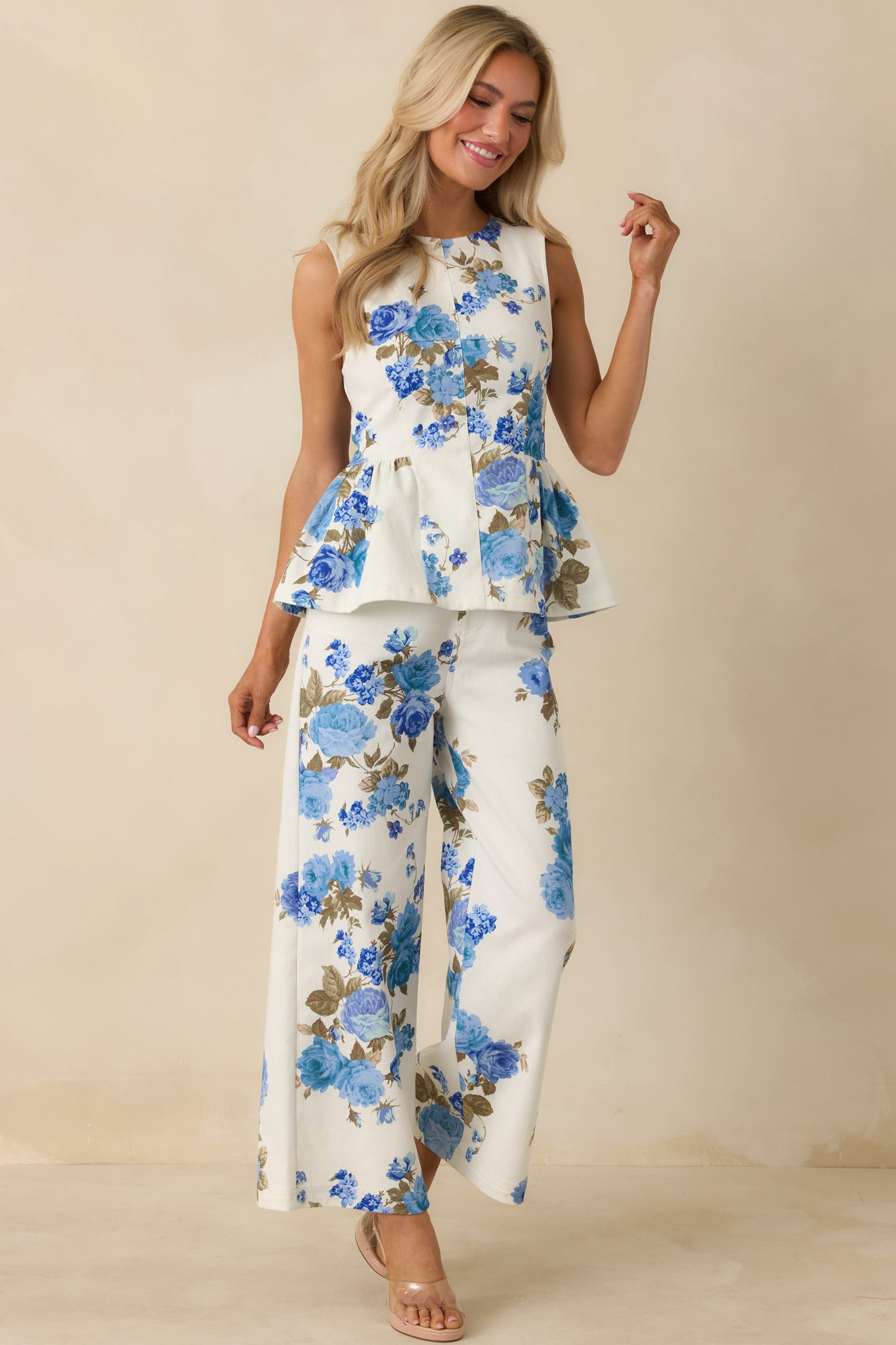 Relaxed-fit blue floral pants with functional front pockets, structured waistband, and breezy wide legs.