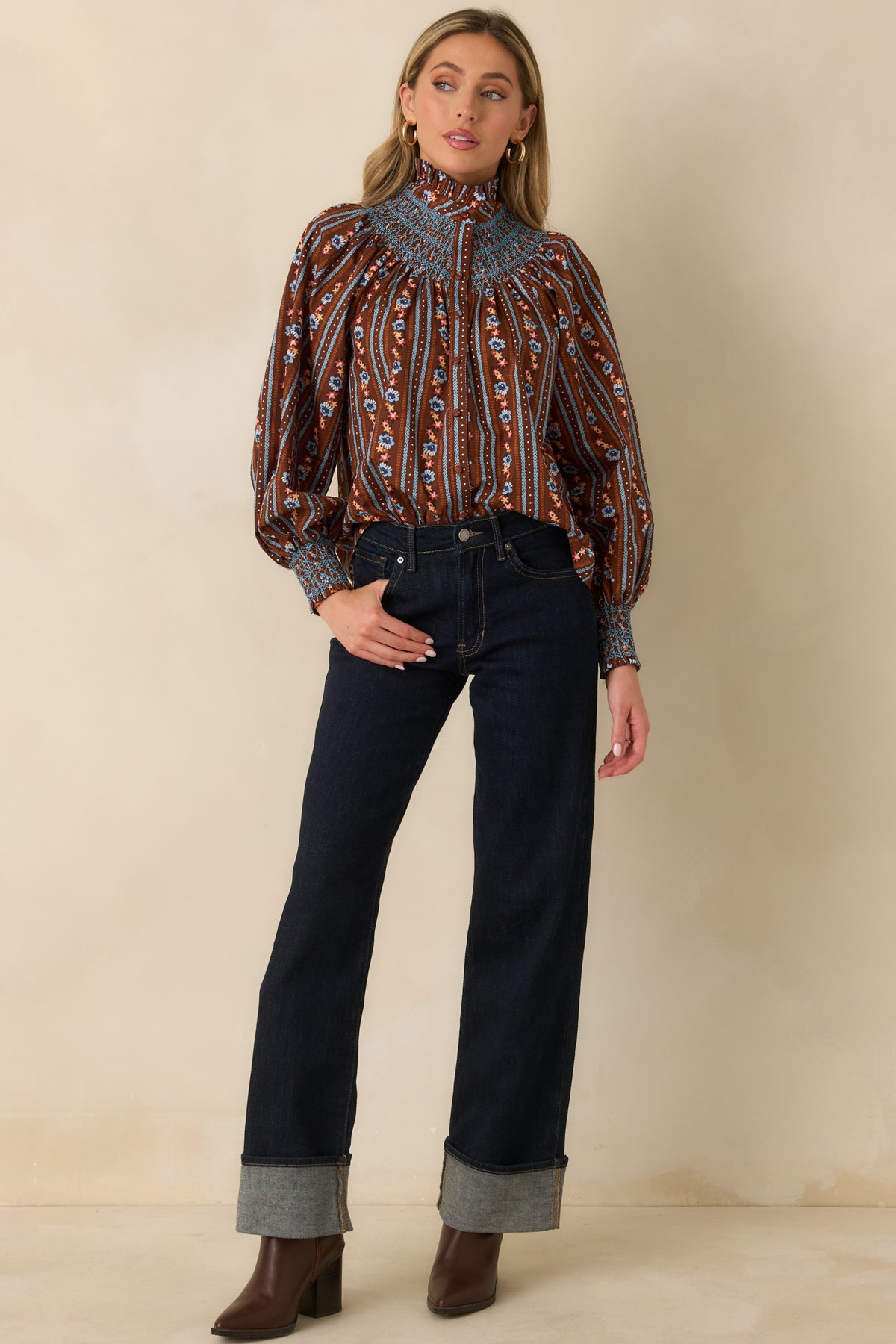 Relaxed cotton blouse combining petite vertical floral stripes with long balloon sleeves and coordinated fabric-covered front buttons.