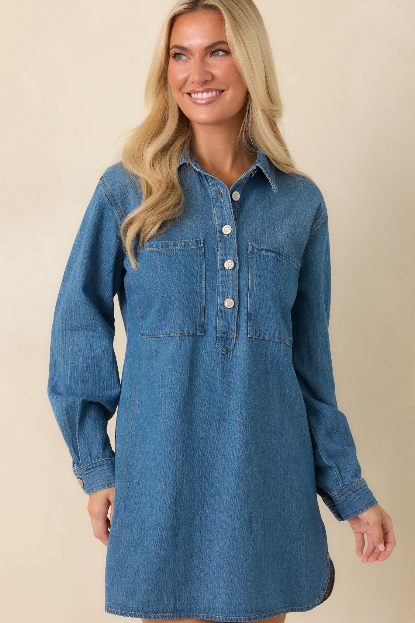 Relaxed dress silhouette featuring the modern hemline and versatile mini length.