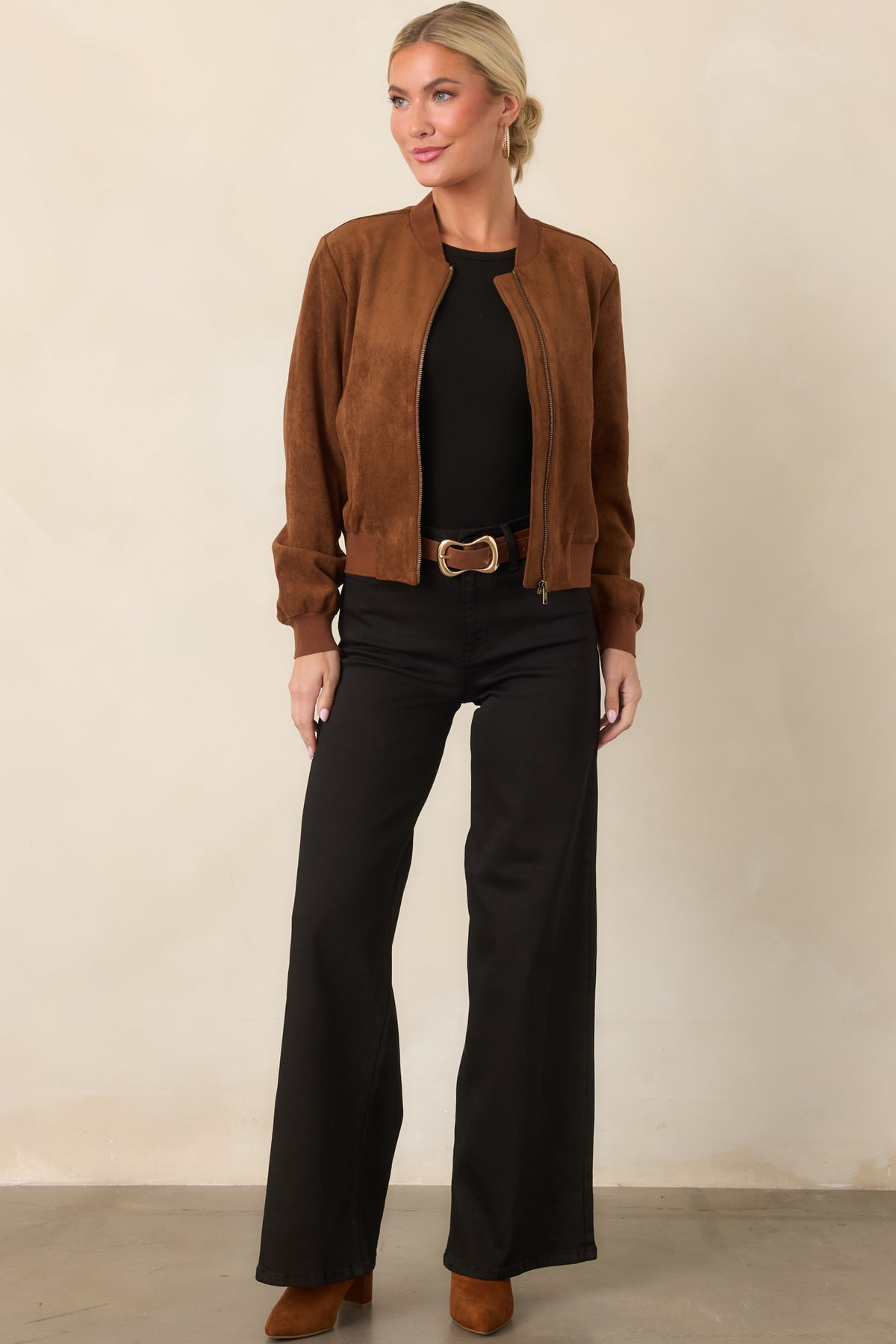 Relaxed faux suede jacket featuring a ribbed baseball collar, full-length sleeves, and functional side welt pockets.