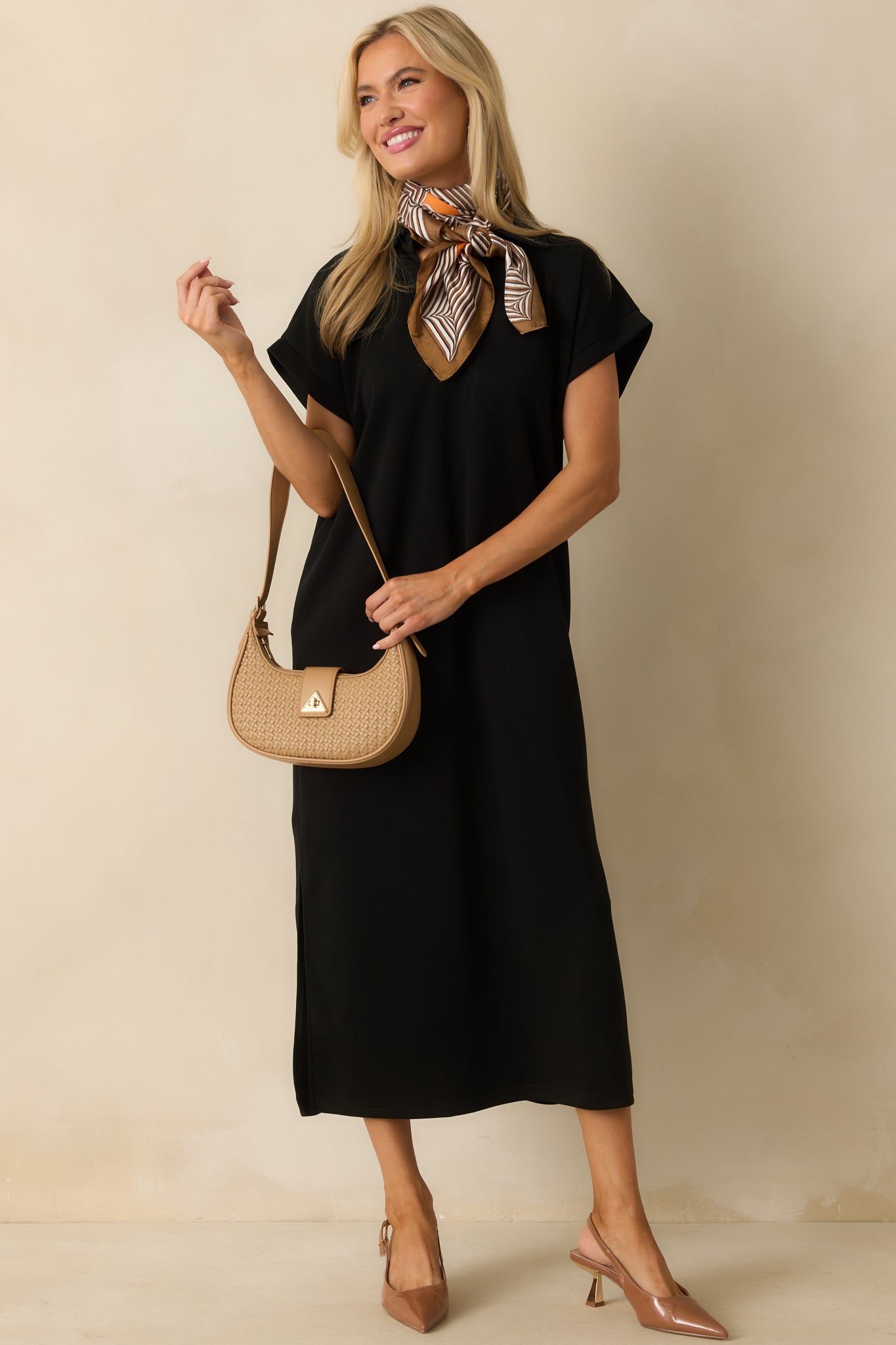 Relaxed fit black dress crafted from buttery soft fabric with a casual drape.