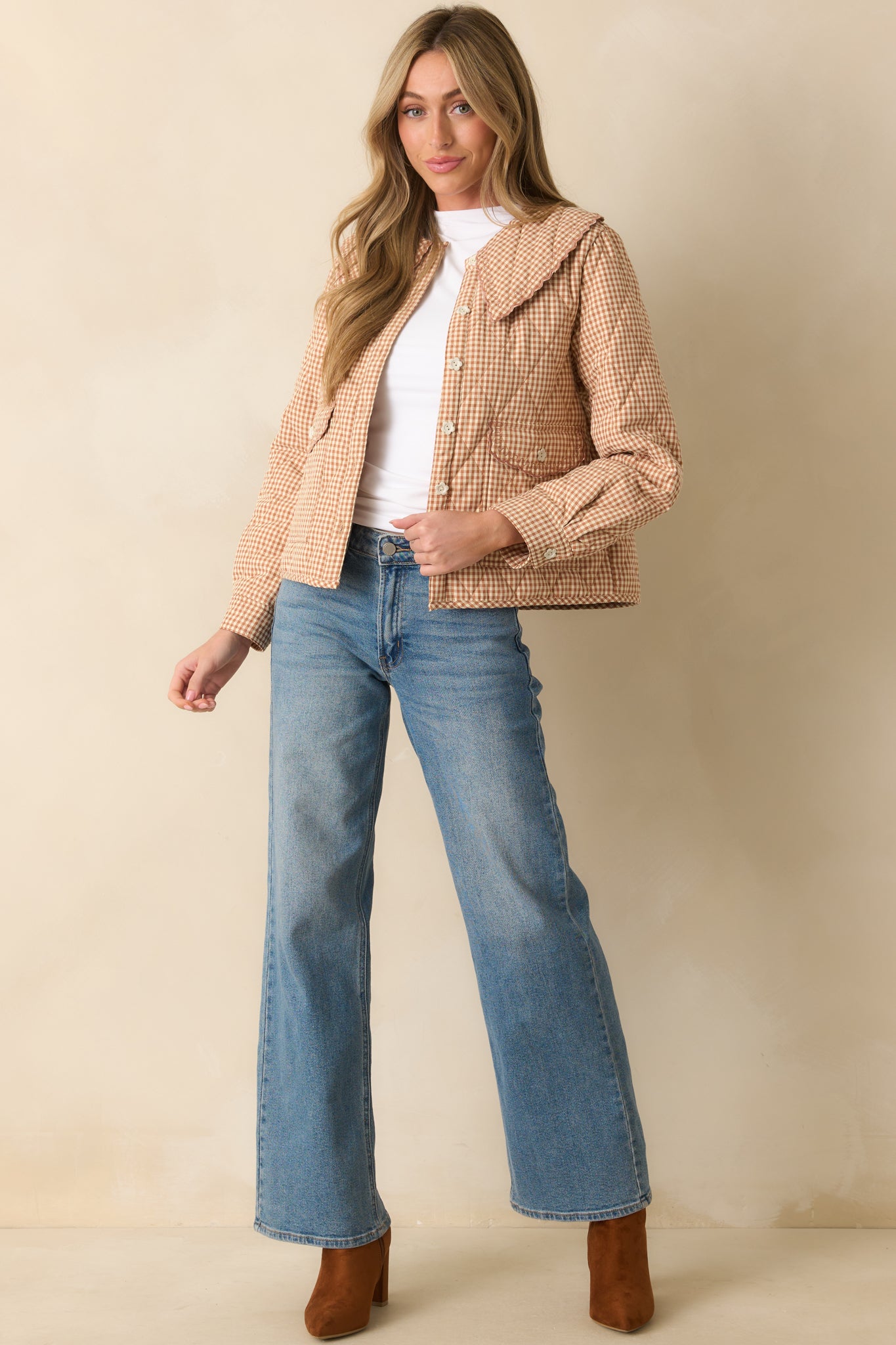 Relaxed-fit gingham jacket highlighted by ivory flower buttons and quilted texture.