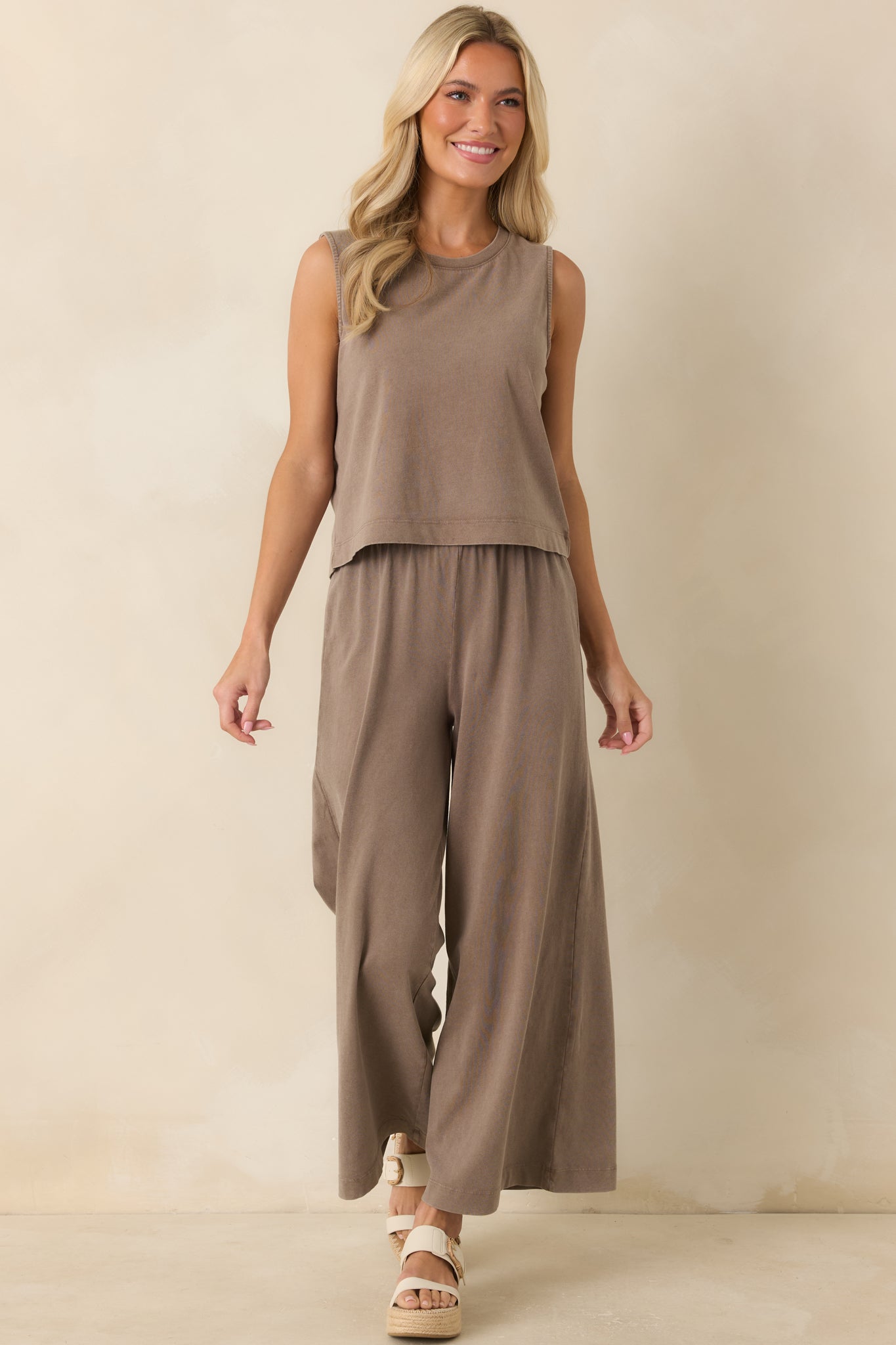 Relaxed-fit muscle tank in dark taupe cotton with a crew neckline and soft drape designed for effortless daily wear.