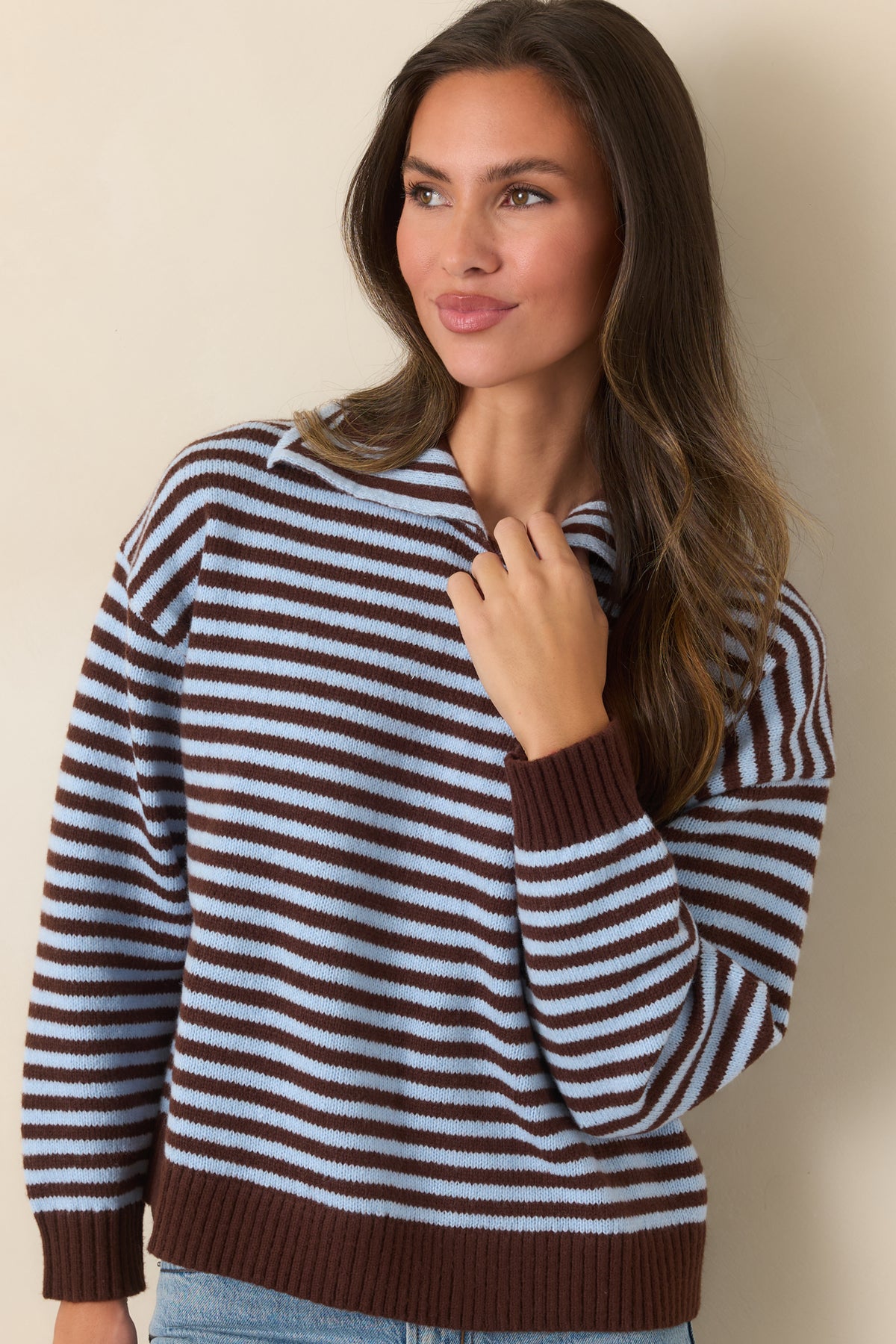 Relaxed top featuring alternating horizontal stripes and rich brown ribbed finishing.