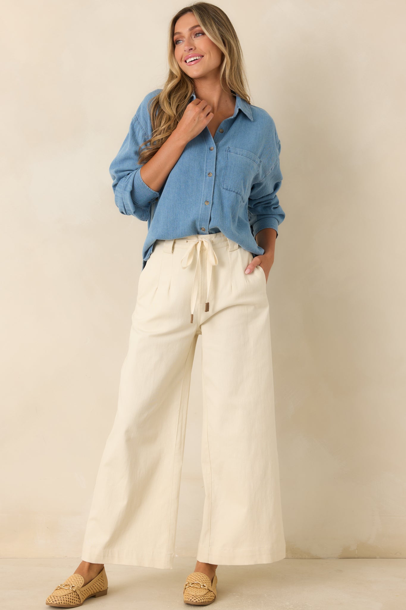 Relaxed long sleeve shirt featuring a single chest pocket and a polished button-front design.