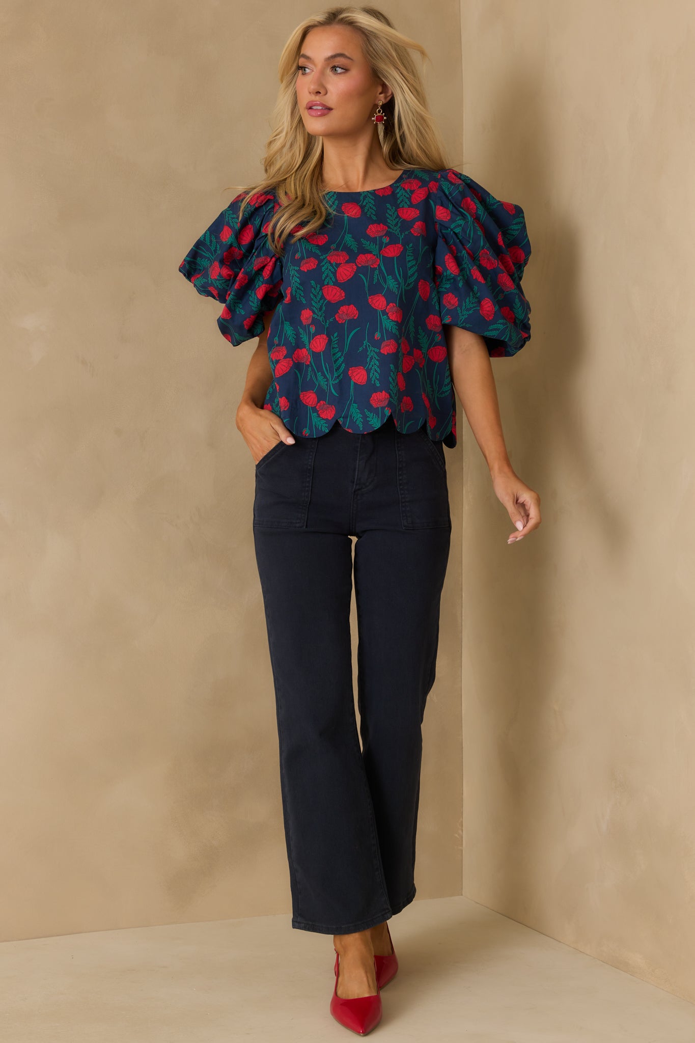 Navy blouse with scalloped bottom edge and a breezy relaxed fit.