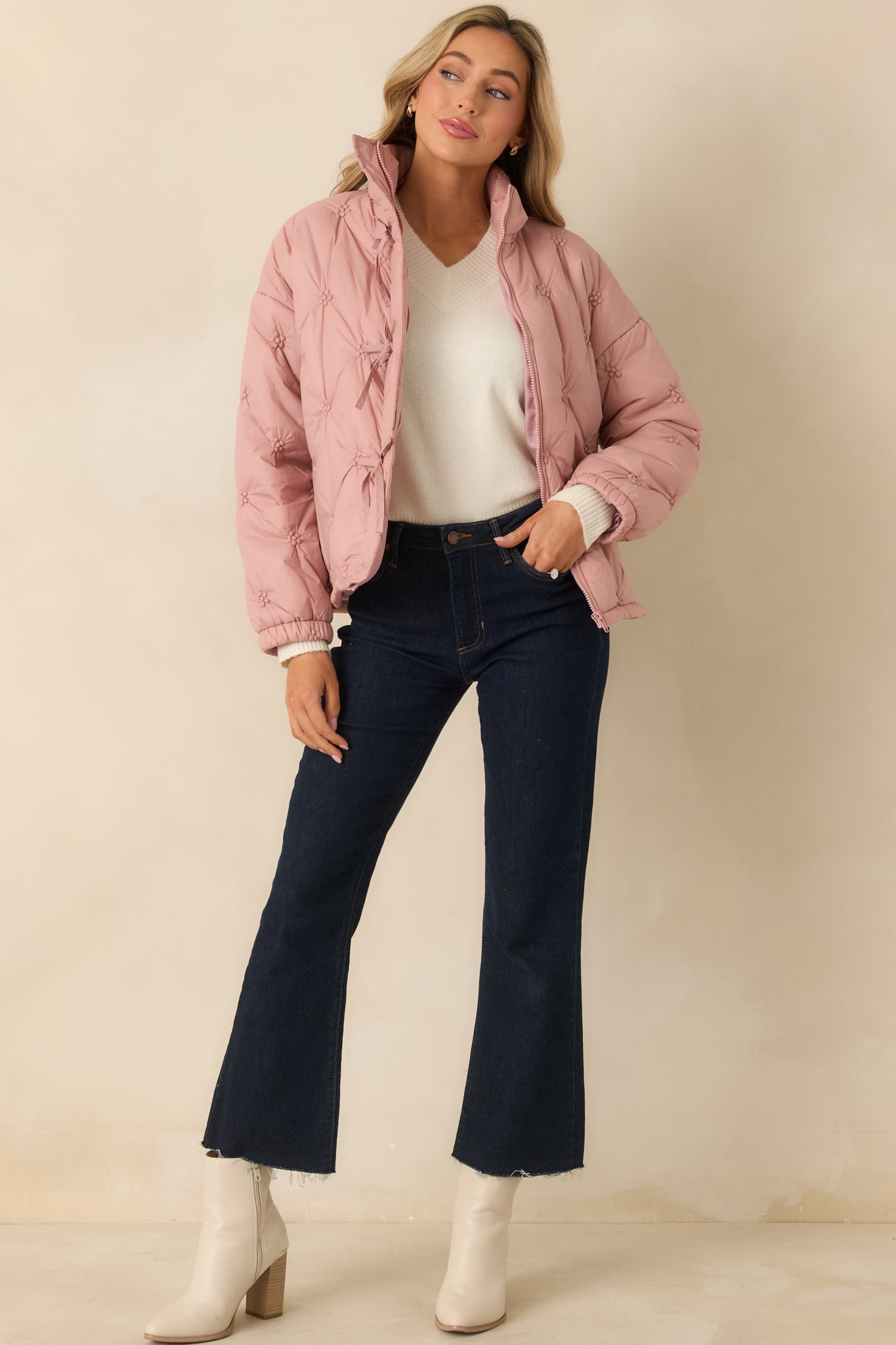 Relaxed-fit blush pink quilted jacket with straight hem, stitched floral pattern, and warm insulated construction.