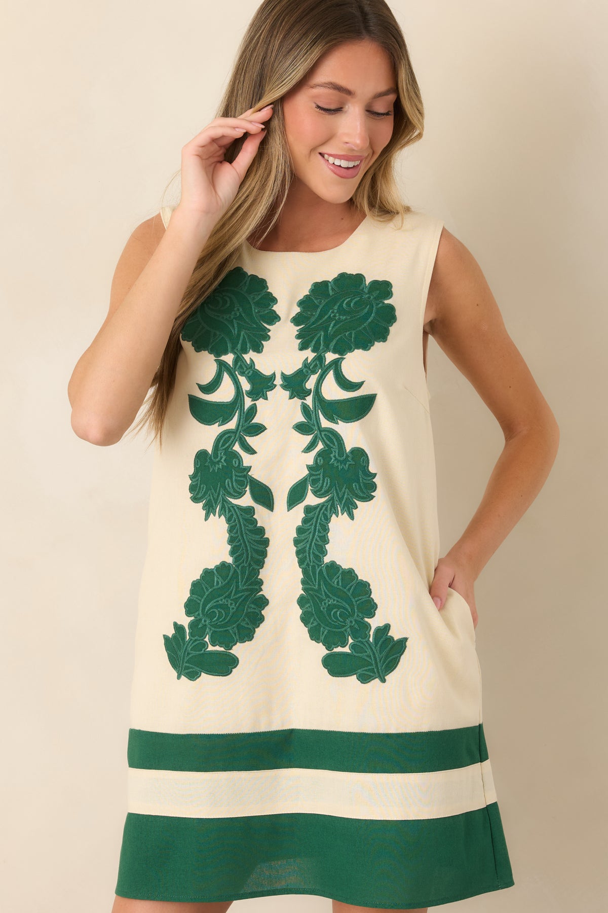 Relaxed shift silhouette and lightweight rayon-linen construction give this floral embroidered mini dress an effortless feel.