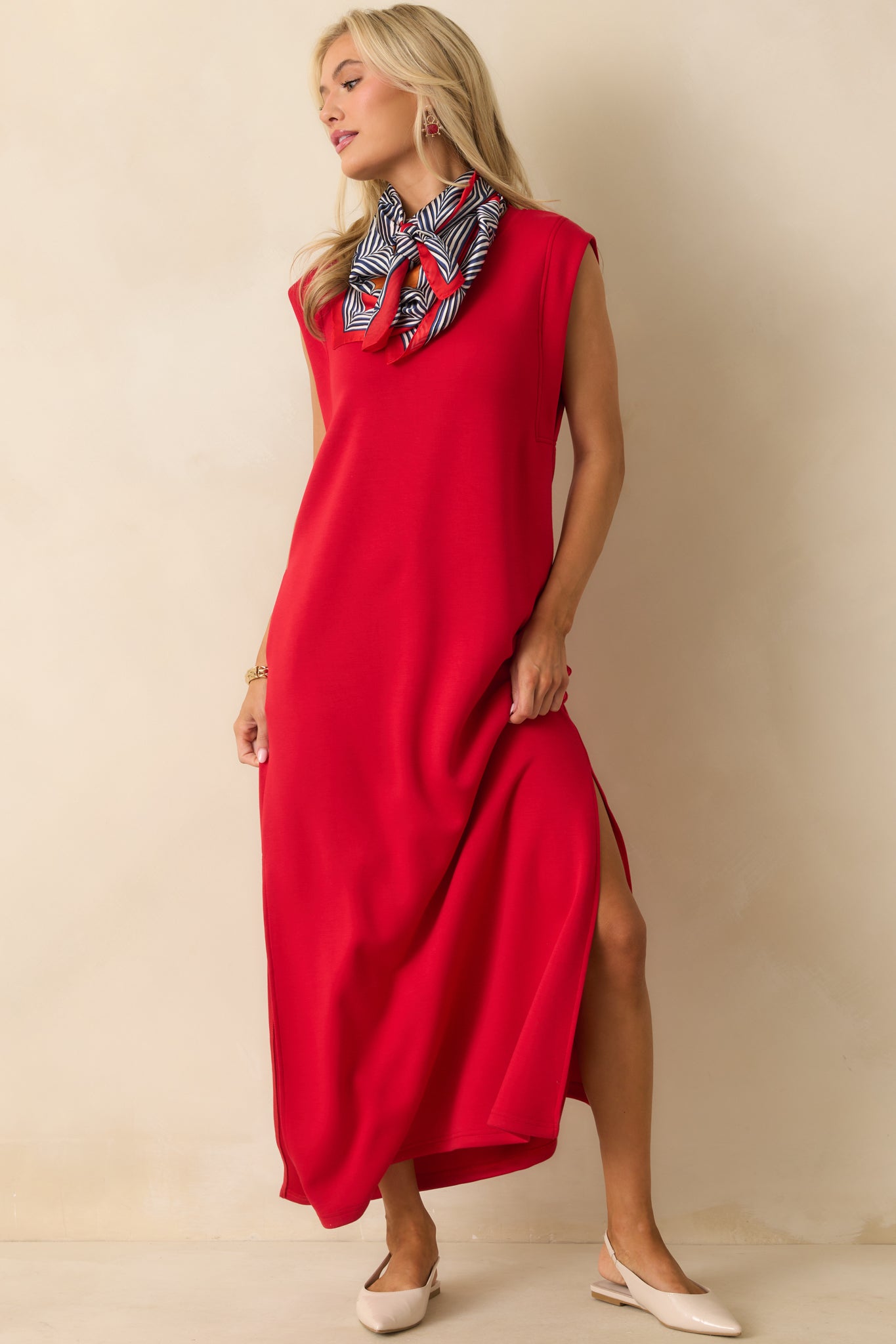 Relaxed-fit red dress with cap sleeves and functional pockets subtly incorporated.