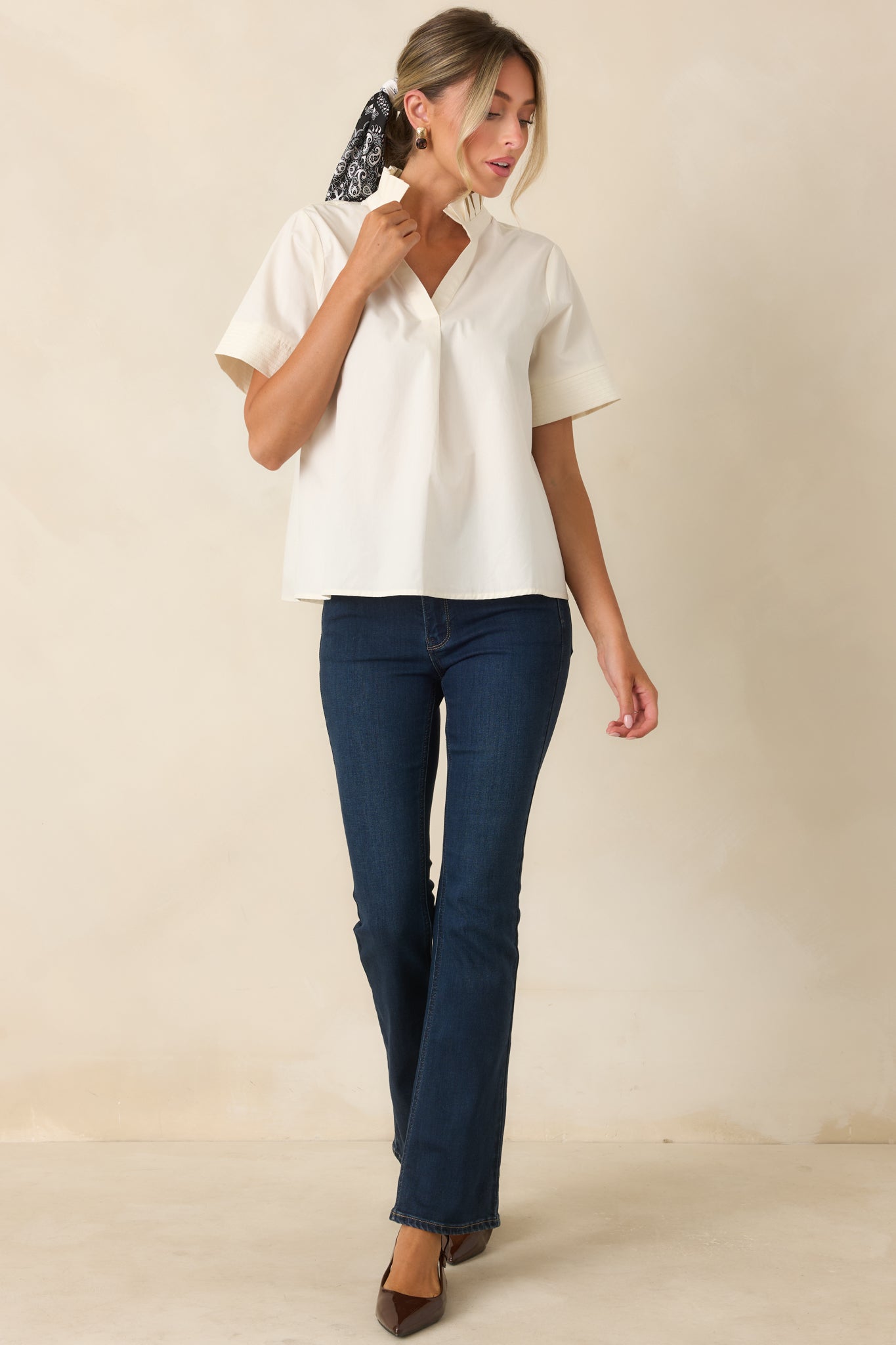 Soft cotton top with a pleated ruffle collar, stitched sleeve cuffs, center back pleat, and comfortable relaxed shape.