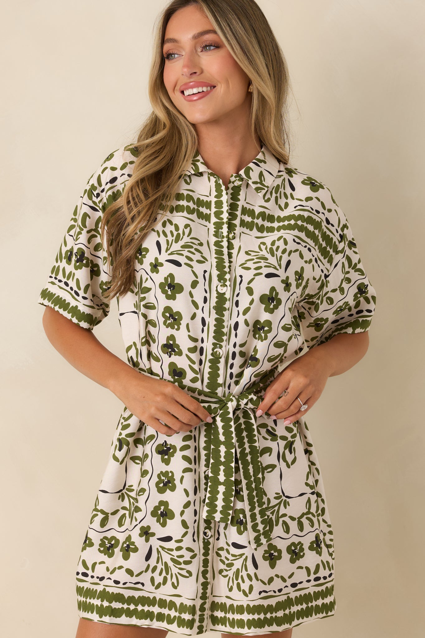 Relaxed short sleeves and lightweight fabric create an effortless look on this paisley dress.