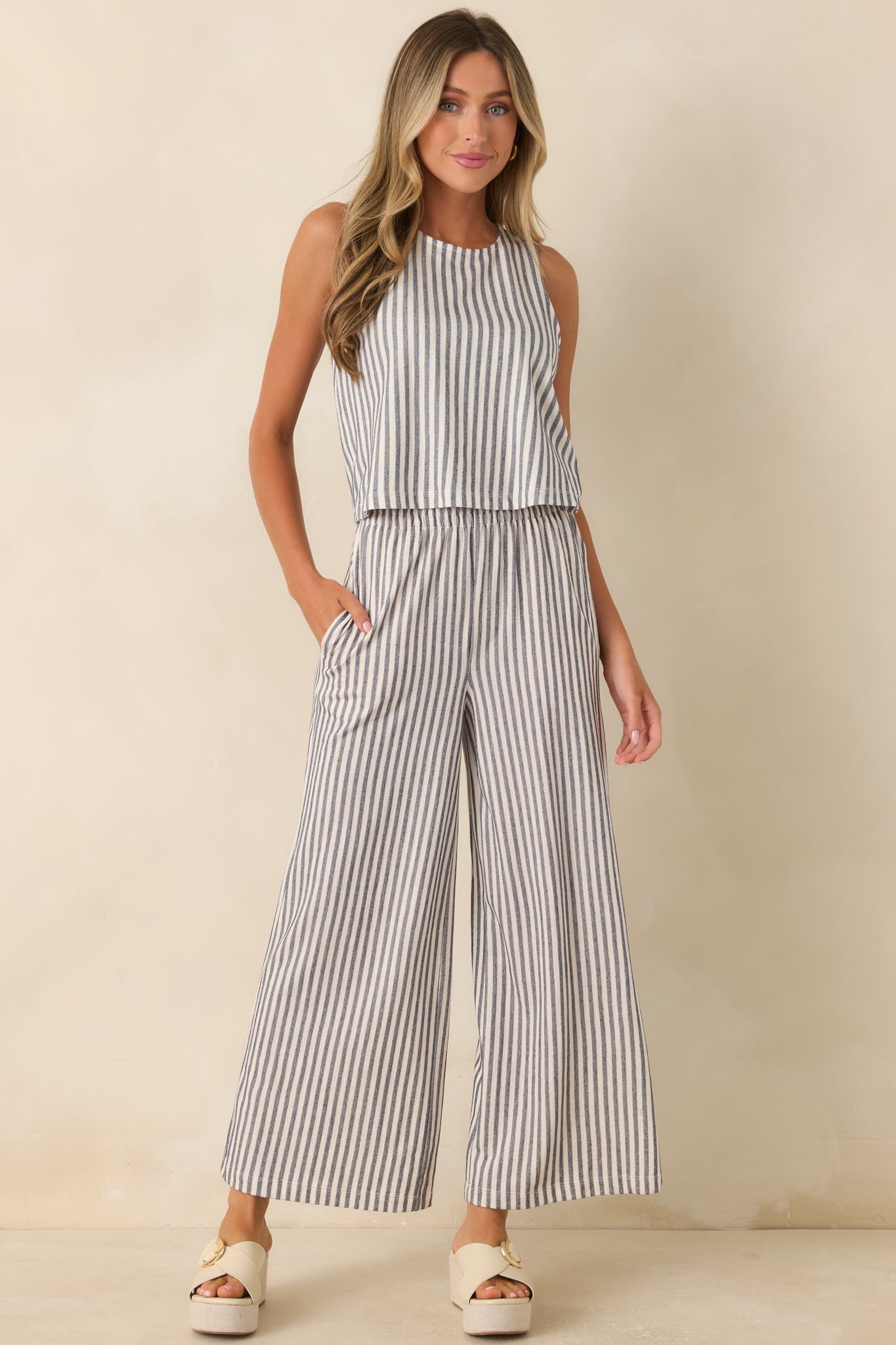 Relaxed sleeveless top showcasing clean vertical stripes, soft knit fabric, and a refined neckline.