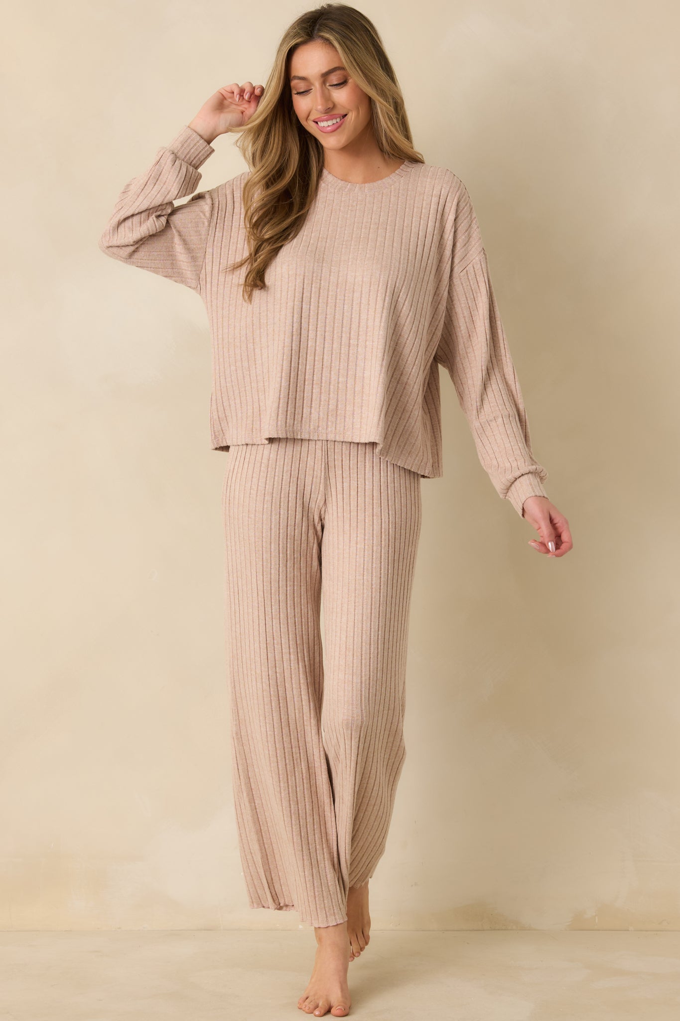 Relaxed taupe top featuring smooth ribbed texture and easy, casual fit.