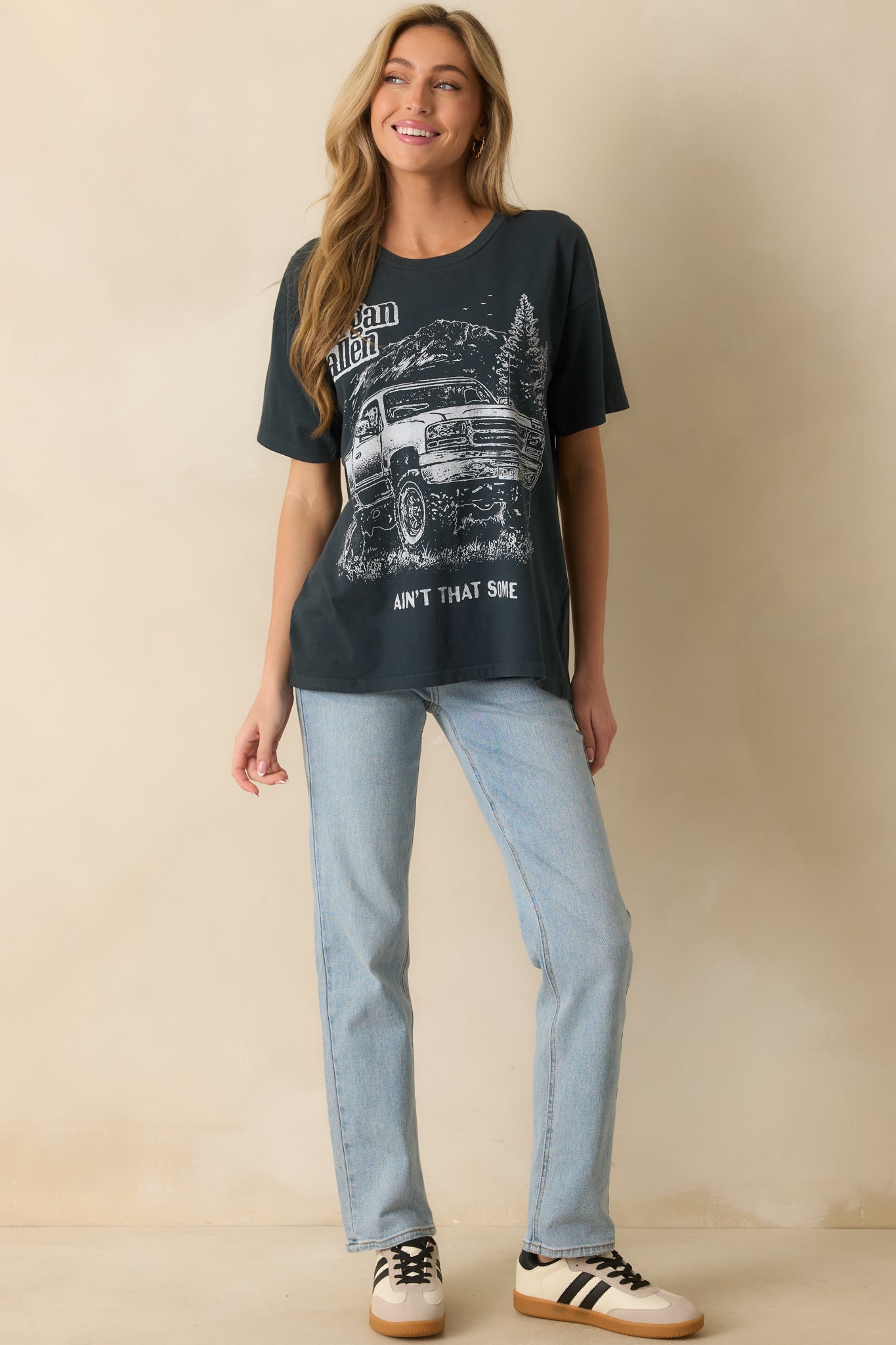 Vintage black graphic tee showing crew neckline and relaxed fit.