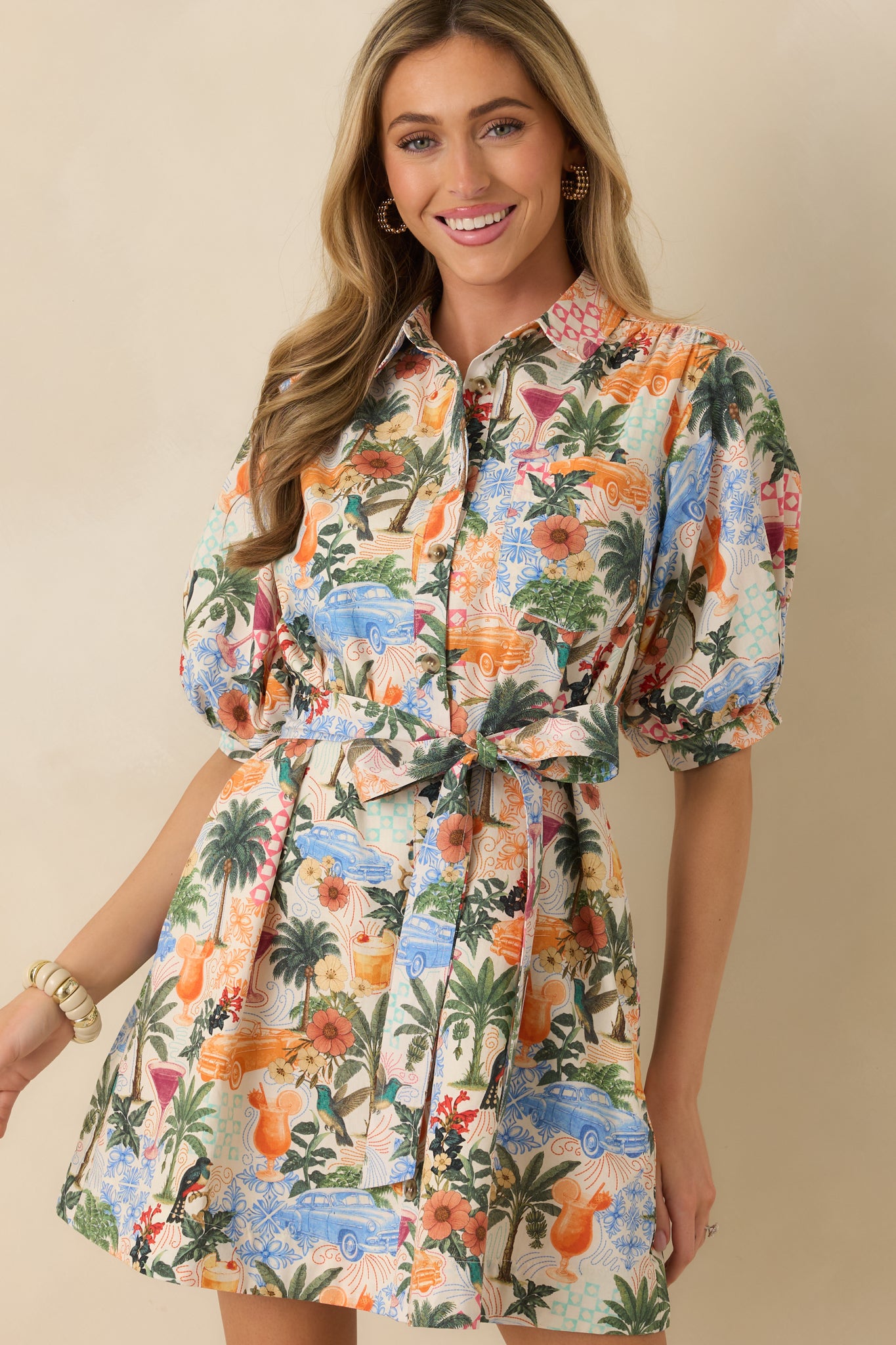 Removable self-tie belt detail accentuating the waist against the lightweight woven material.