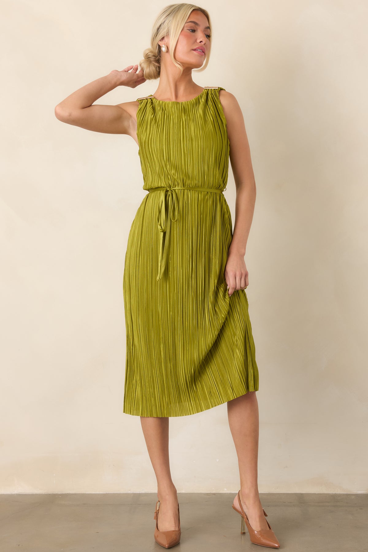 Retro-inspired plissé midi dress with a delicate sheen, fluid pleated skirt, gold shoulder embellishments, and a graceful tied waist