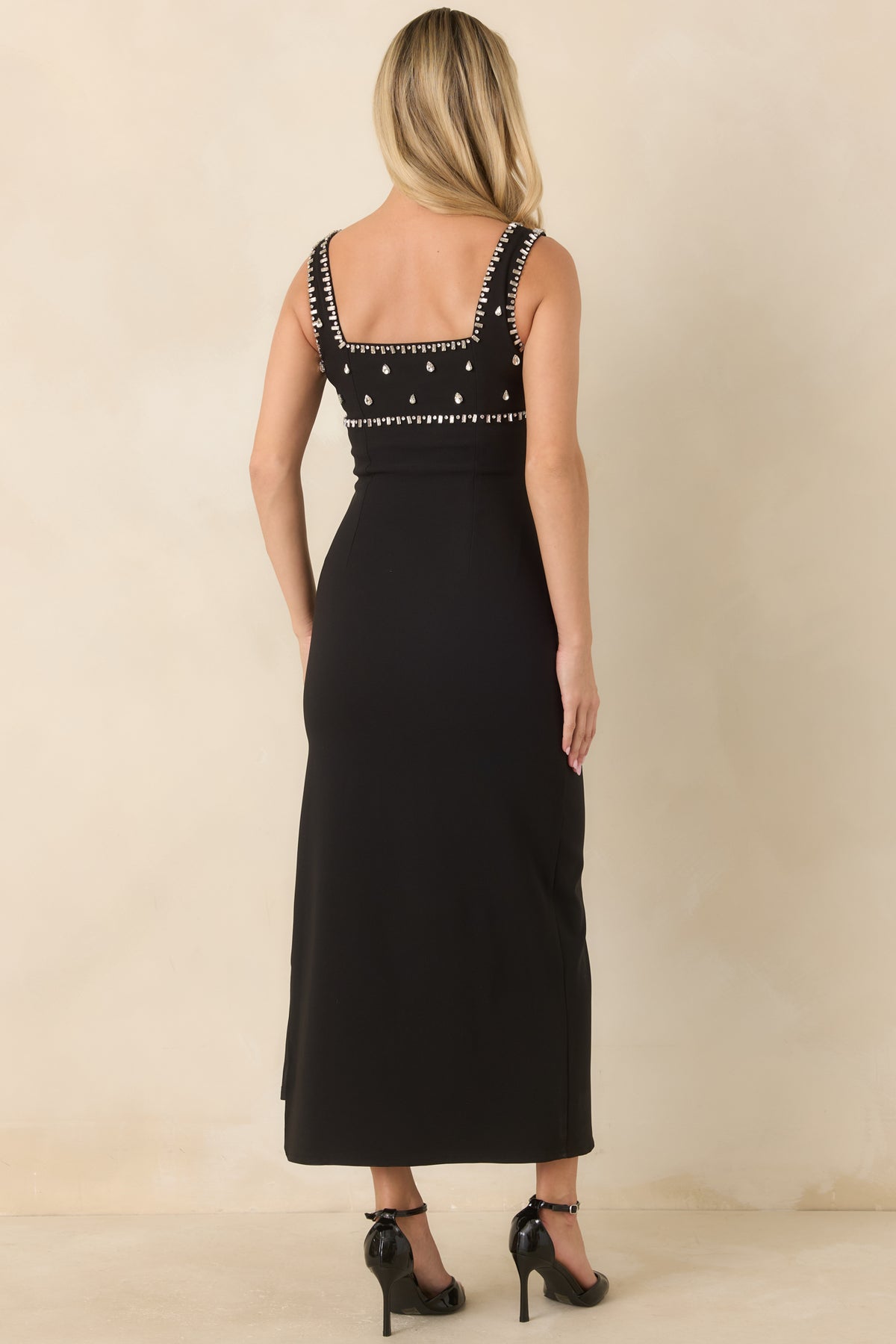 Rear of the fitted midi dress showing teardrop rhinestone embellishments across the back bodice.
