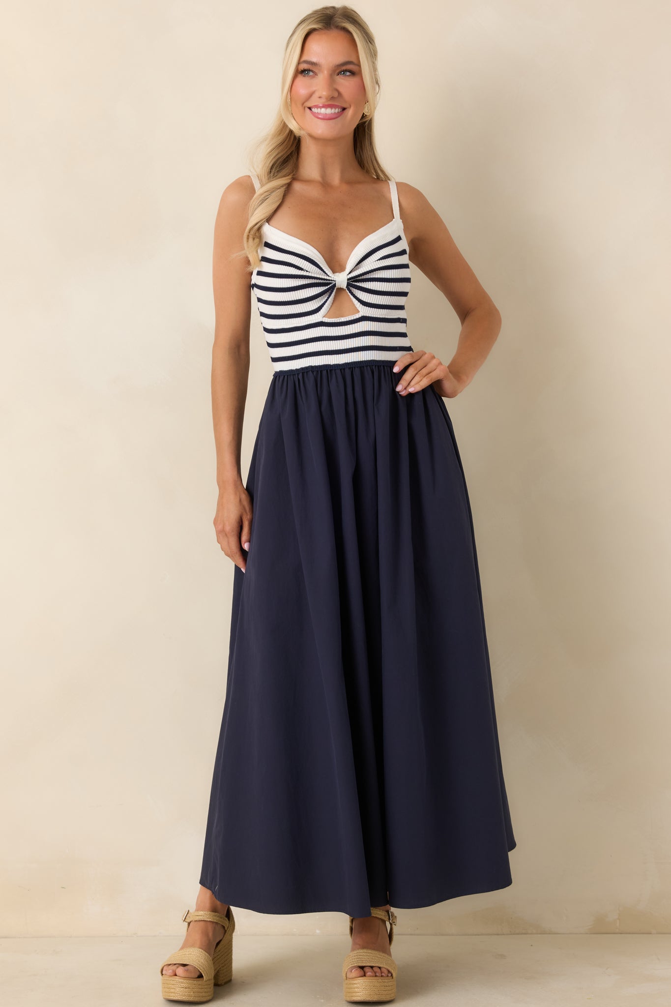 Ribbed bodice midi dress with navy and ivory color block and soft woven skirt.