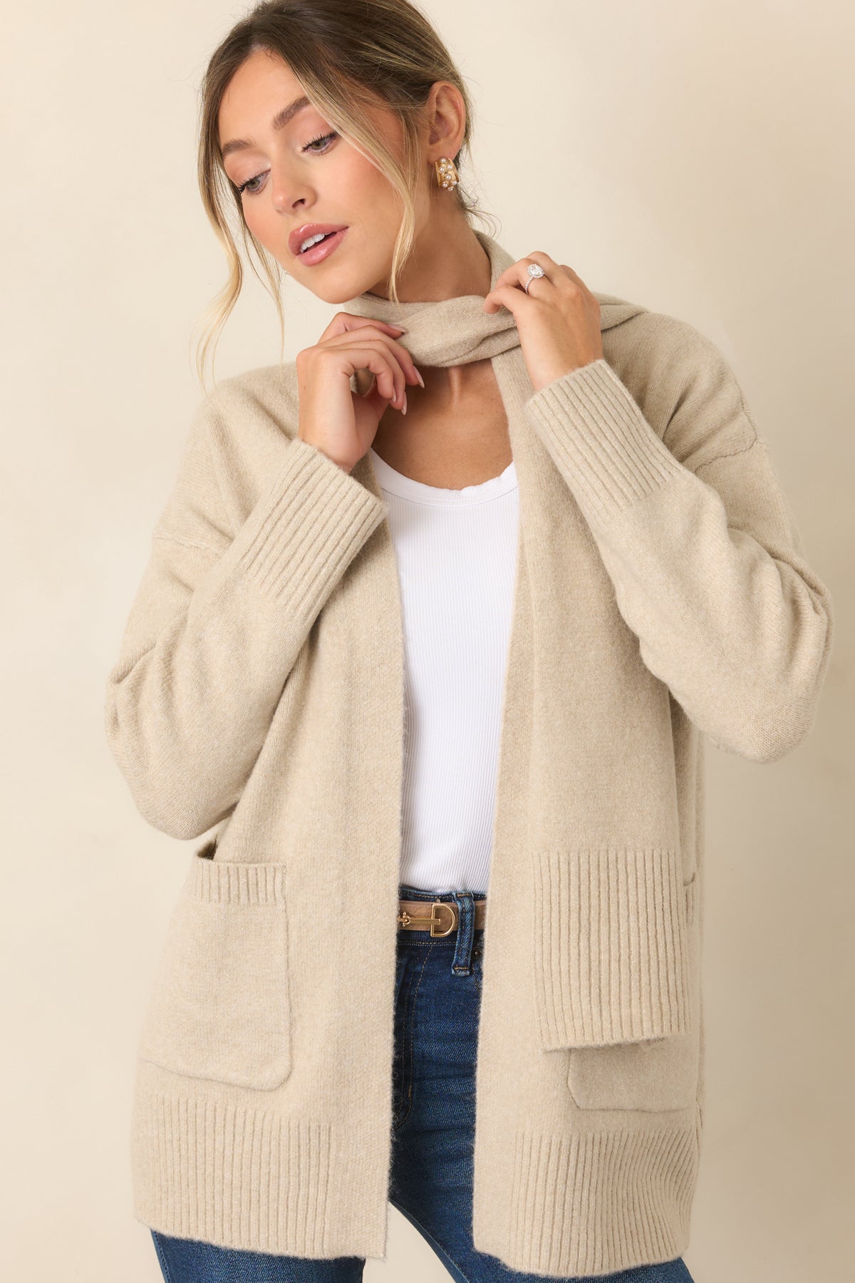 Ribbed hem and open-front construction define the softly relaxed cardigan silhouette.