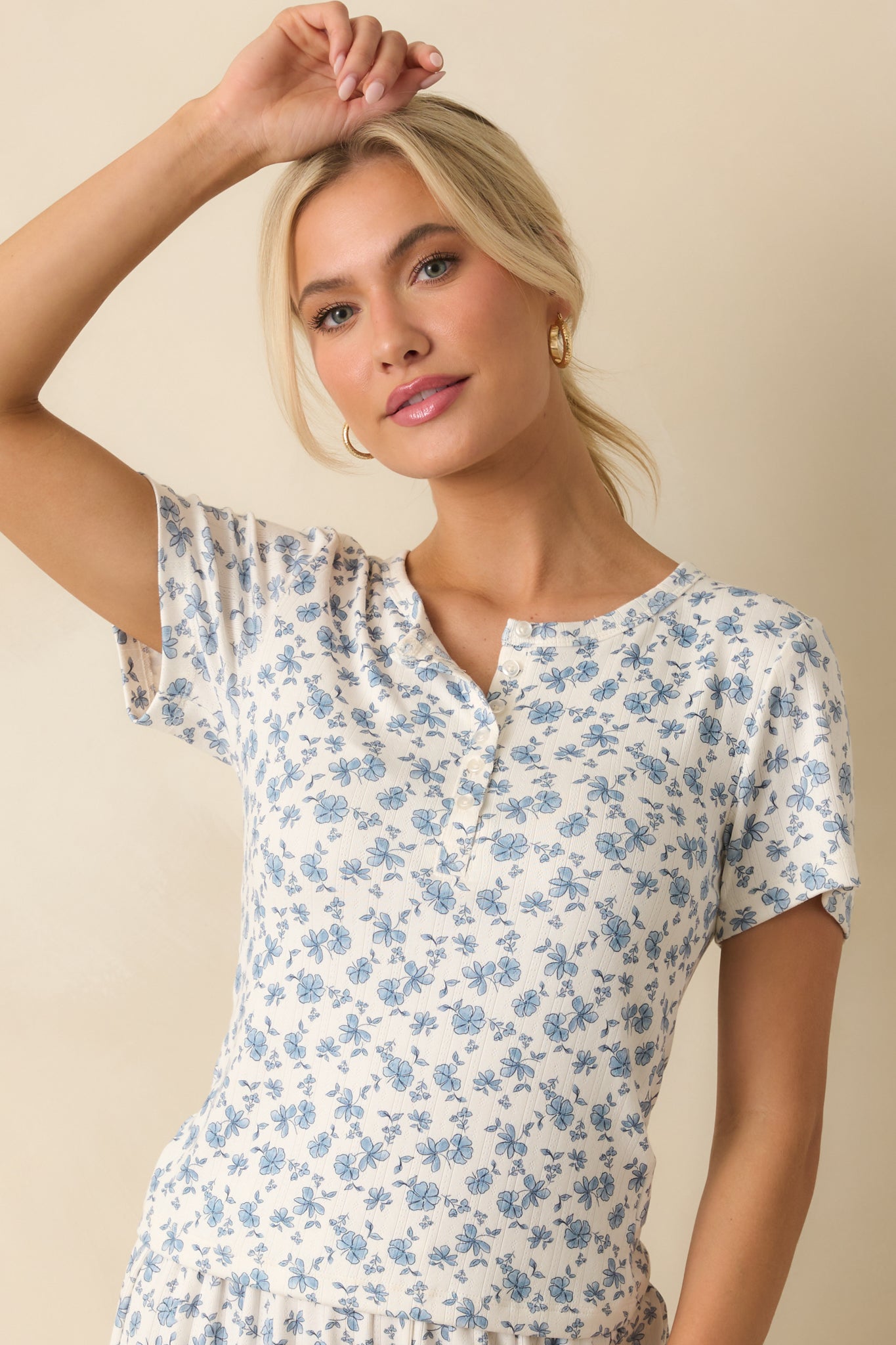 Ribbed knit fabric bringing stretch and texture to the fitted floral top.