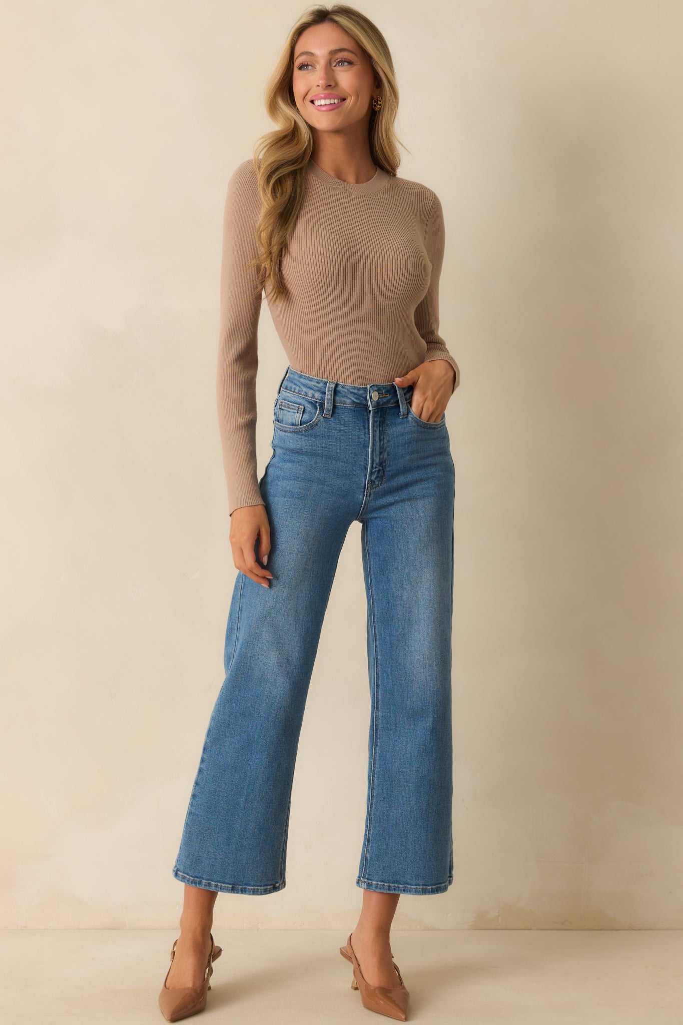 Ribbed knit top featuring a straight hem and smooth taupe texture.