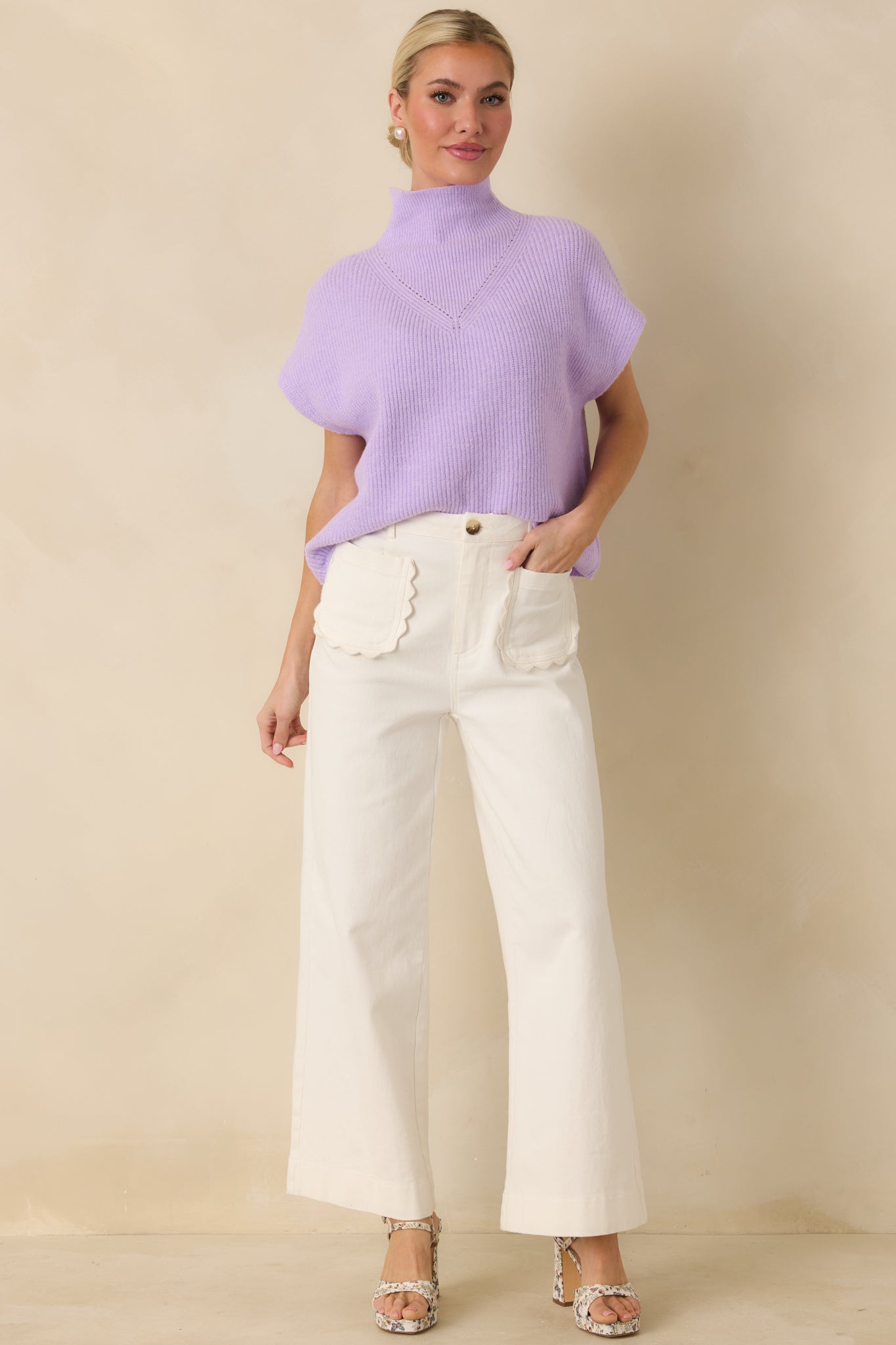Ribbed lavender top with cap sleeves, mock neckline, and refined yet relaxed silhouette.