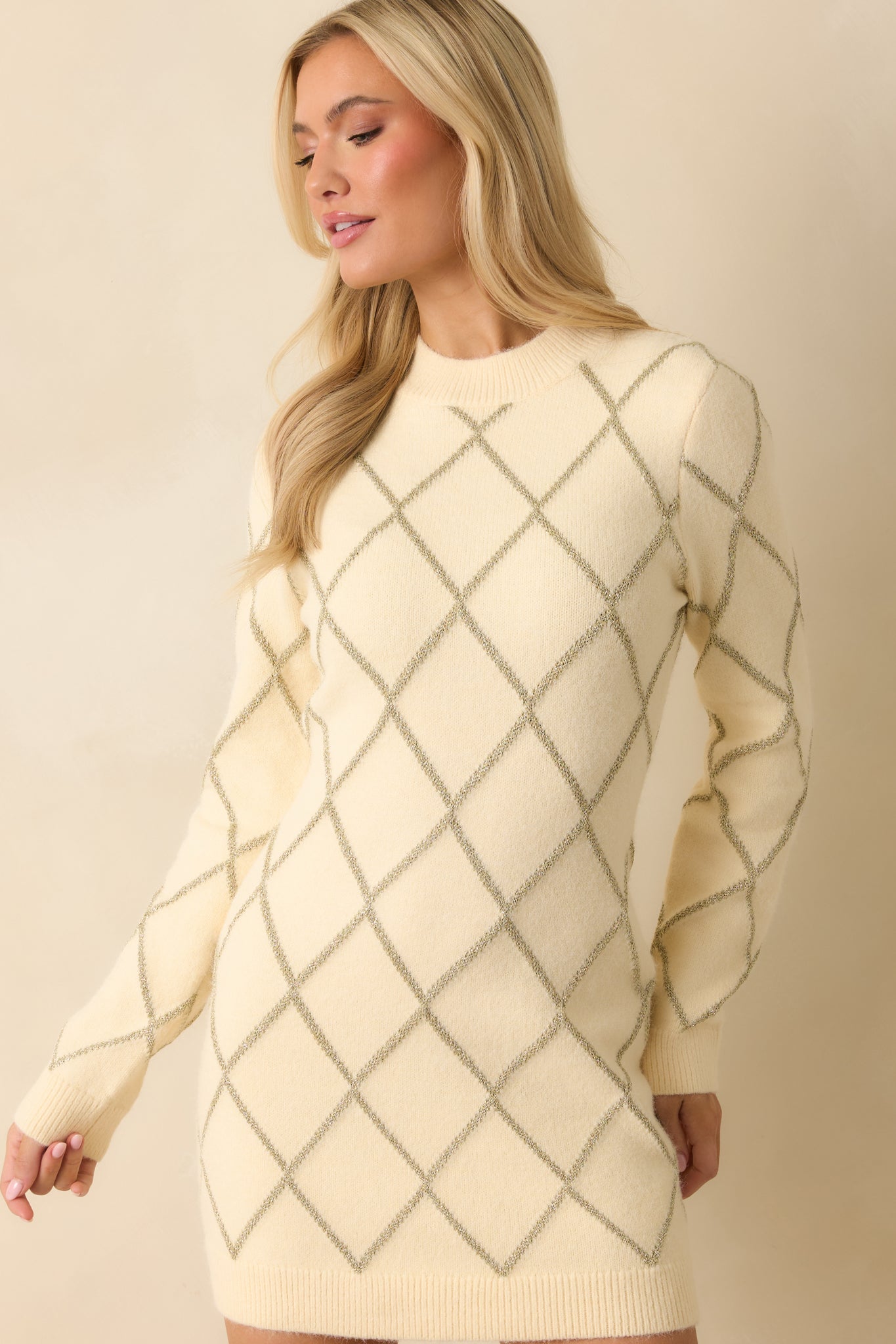 Ribbed round neckline and soft knit highlighting subtle shimmer in the argyle design.