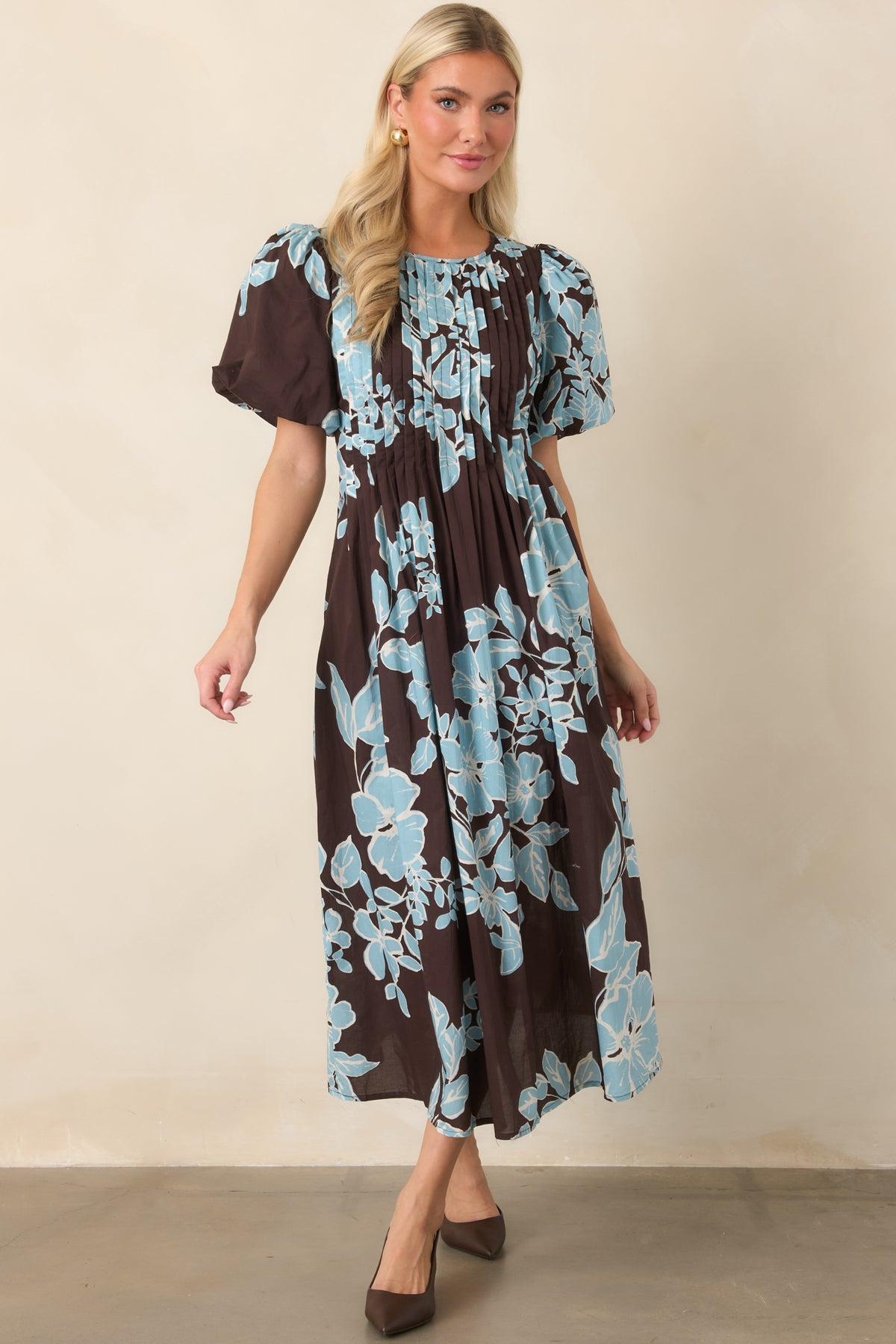 Rich chocolate floral midi dress with a defined waist and gently flared skirt for a graceful silhouette.