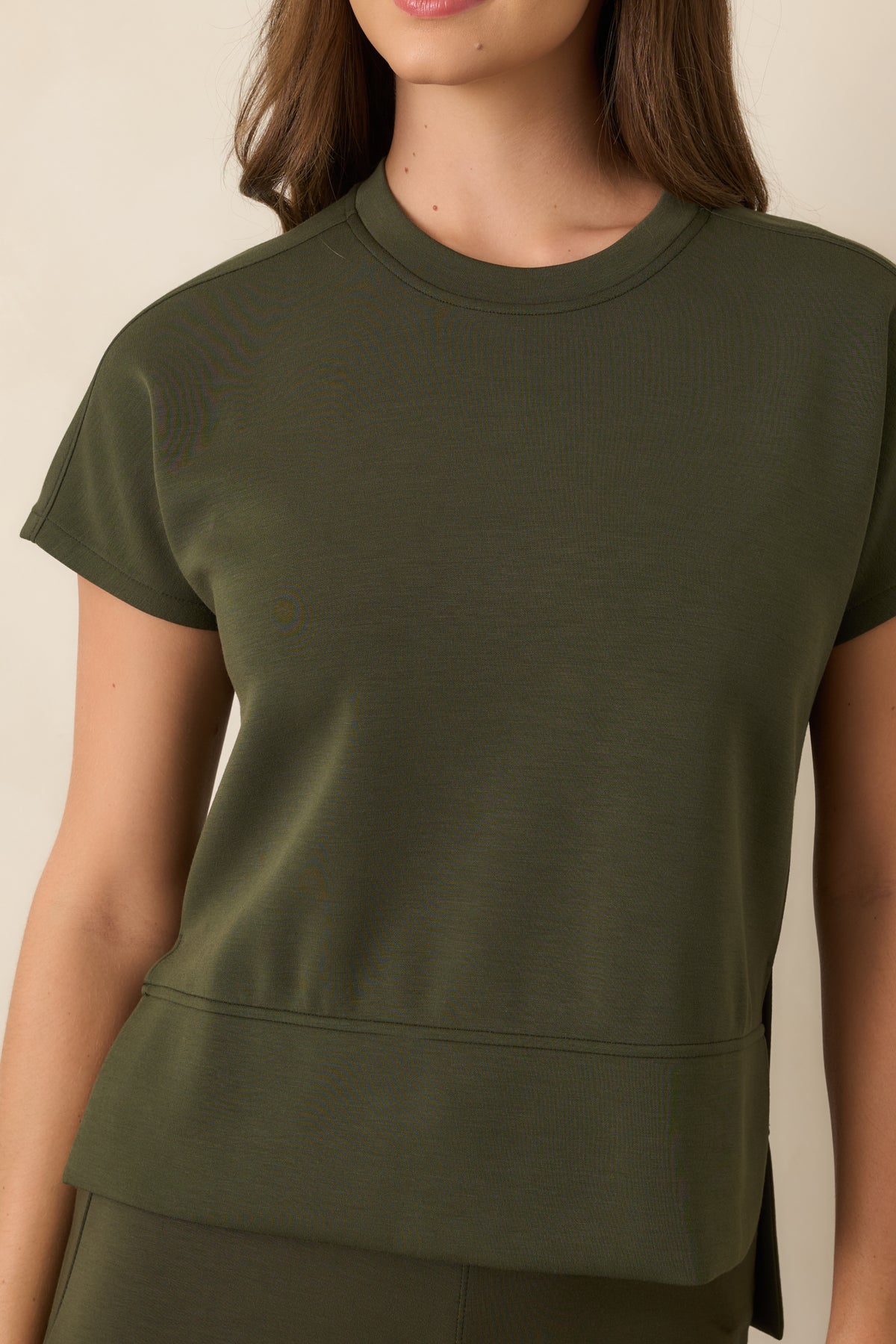 Detailed view highlighting the rich olive hue, exceptionally smooth spacer fabric, and subtle stretch of the top.