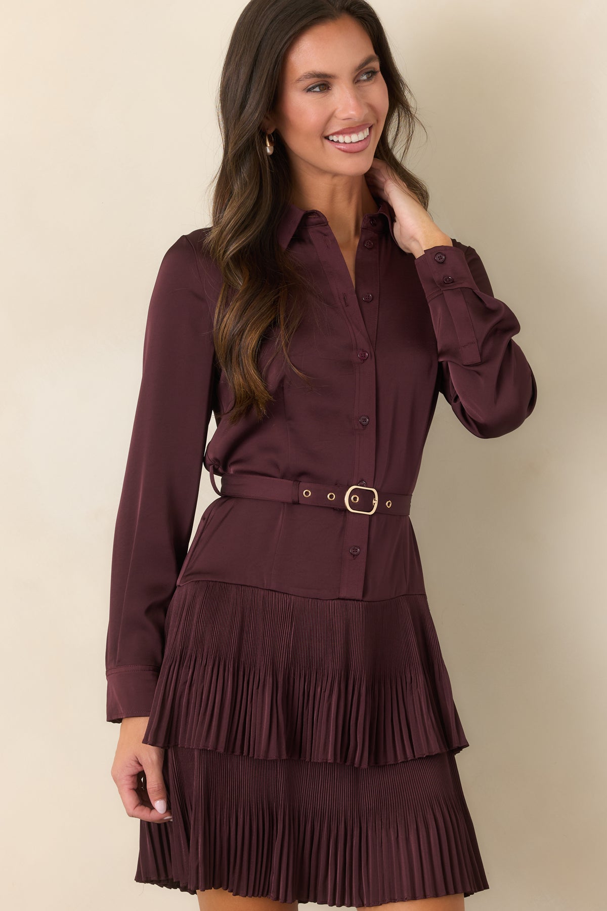 Rich plum mini dress showcasing the removable belt with gold-tone buckle and coordinating eyelets.