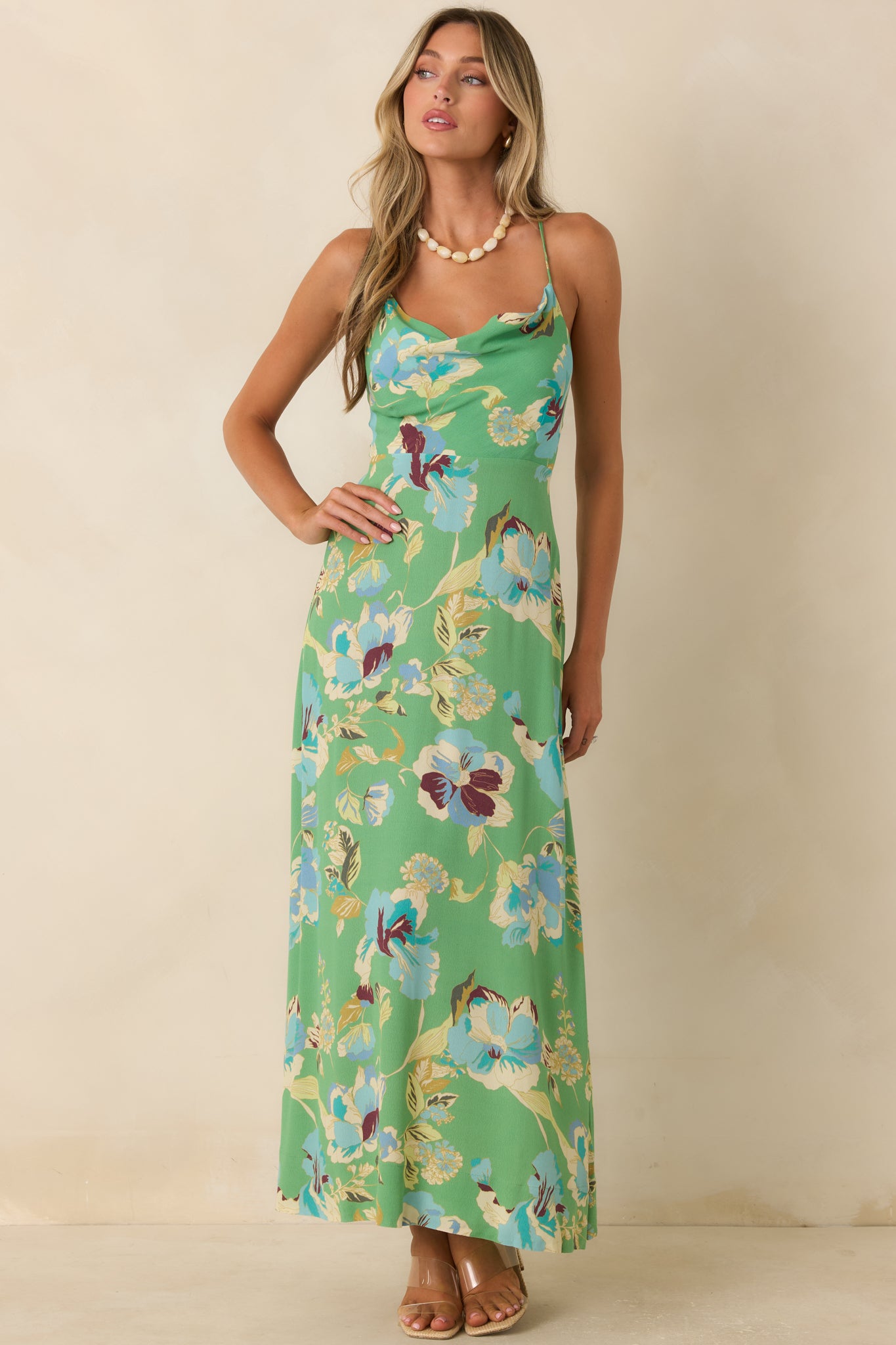Romantic green floral dress showcasing a flattering fit-and-flare shape and softly draped neckline.