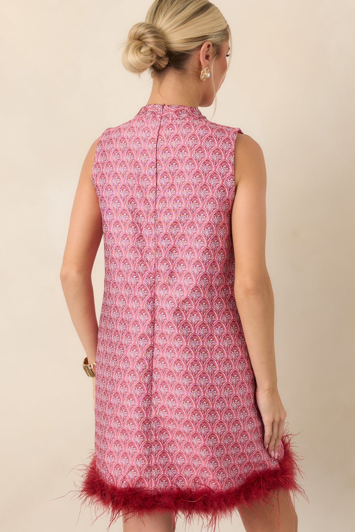Rear view of the rose pink and burgundy floral mini dress showing the sleeveless shift silhouette and concealed back zipper.