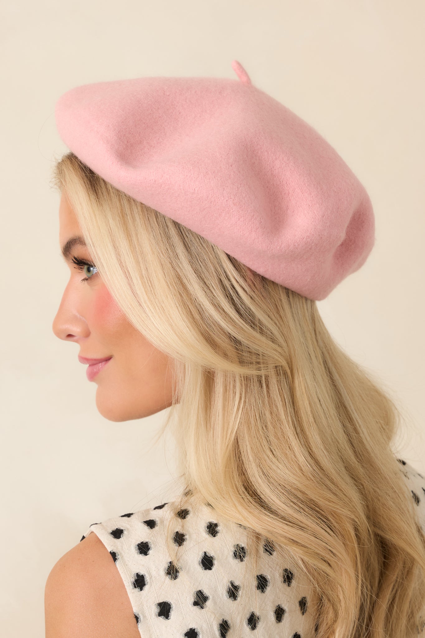 Rose pink wool beret featuring a classic round silhouette, smooth texture, and structured shape.