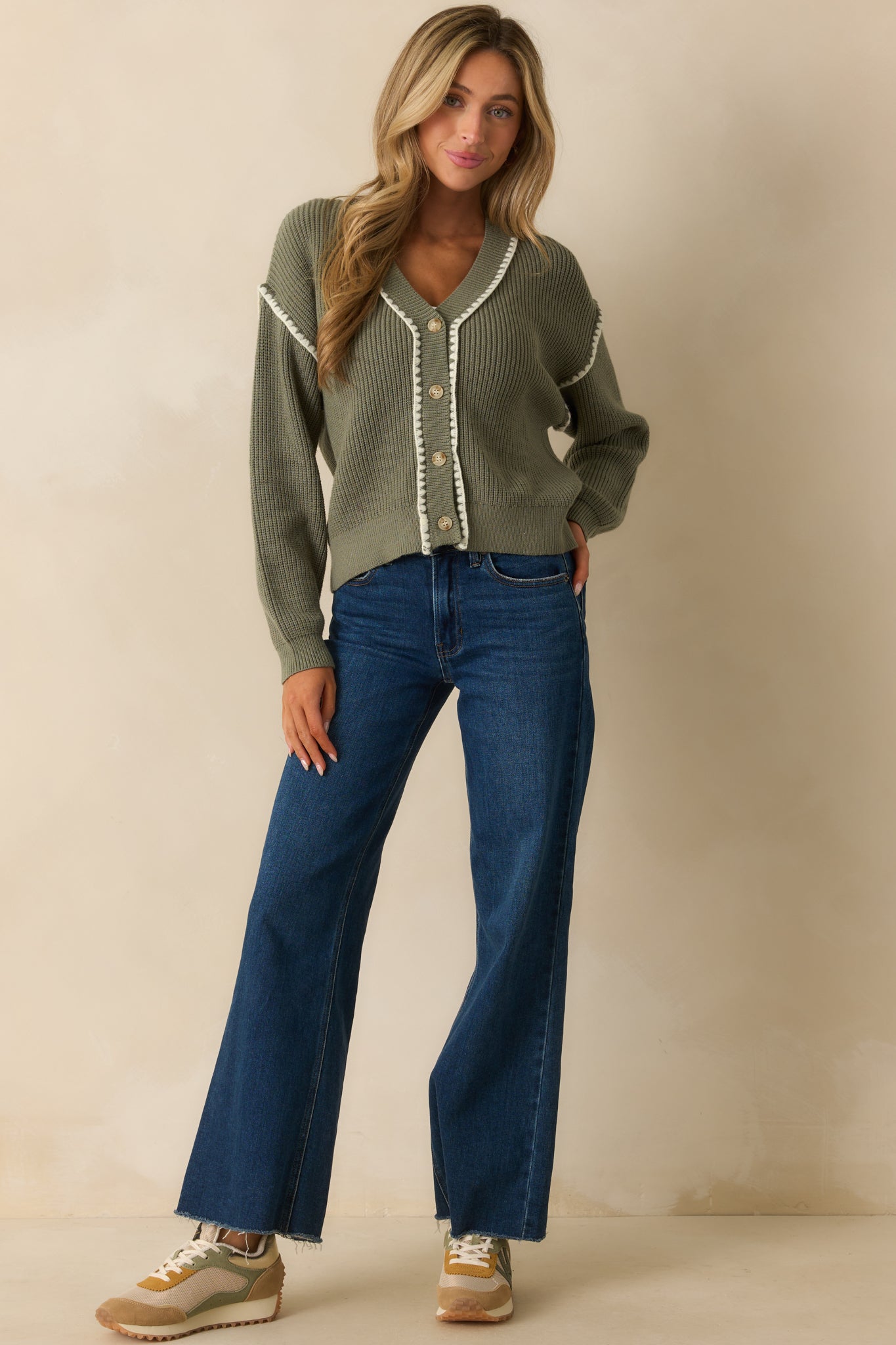 Classic sage green button-front cardigan with ribbed texture and subtle white trim detailing.