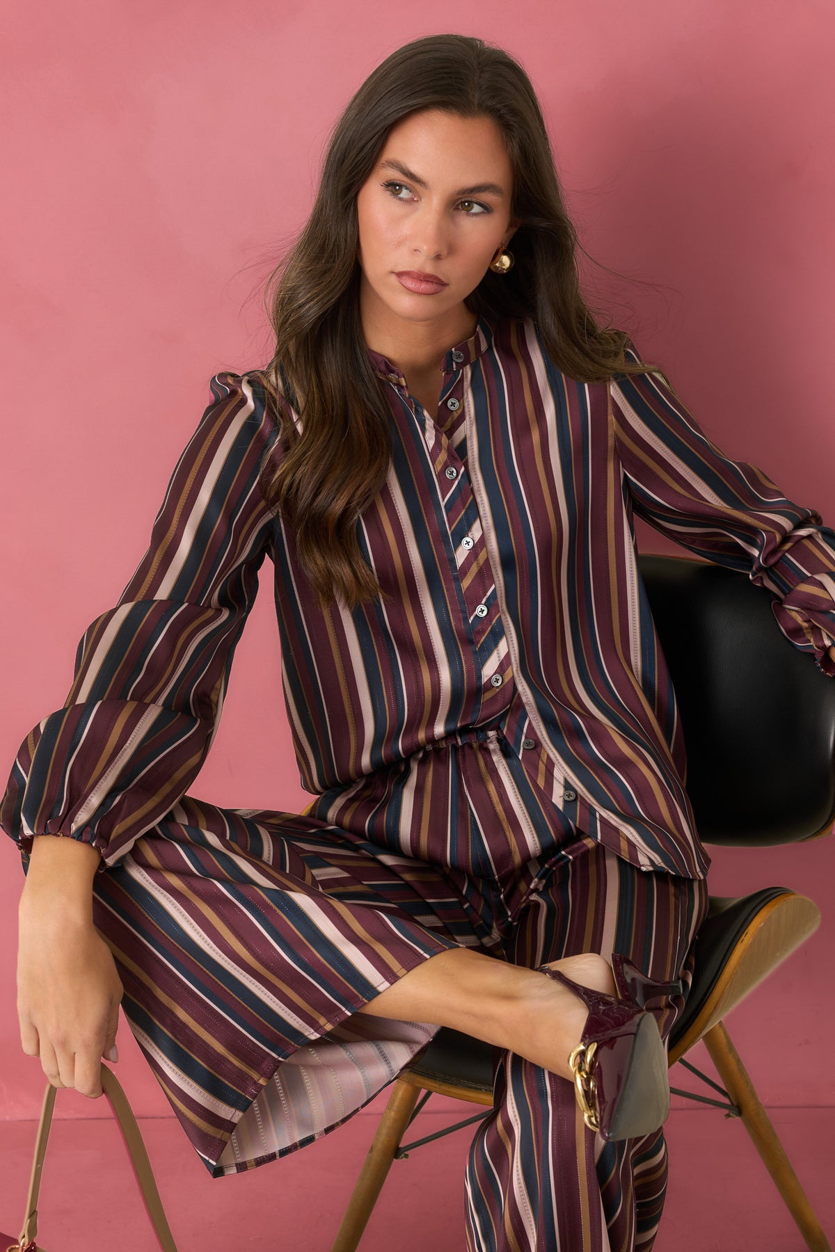 Satin blouse featuring burgundy, navy, champagne, and olive stripes with a relaxed silhouette.