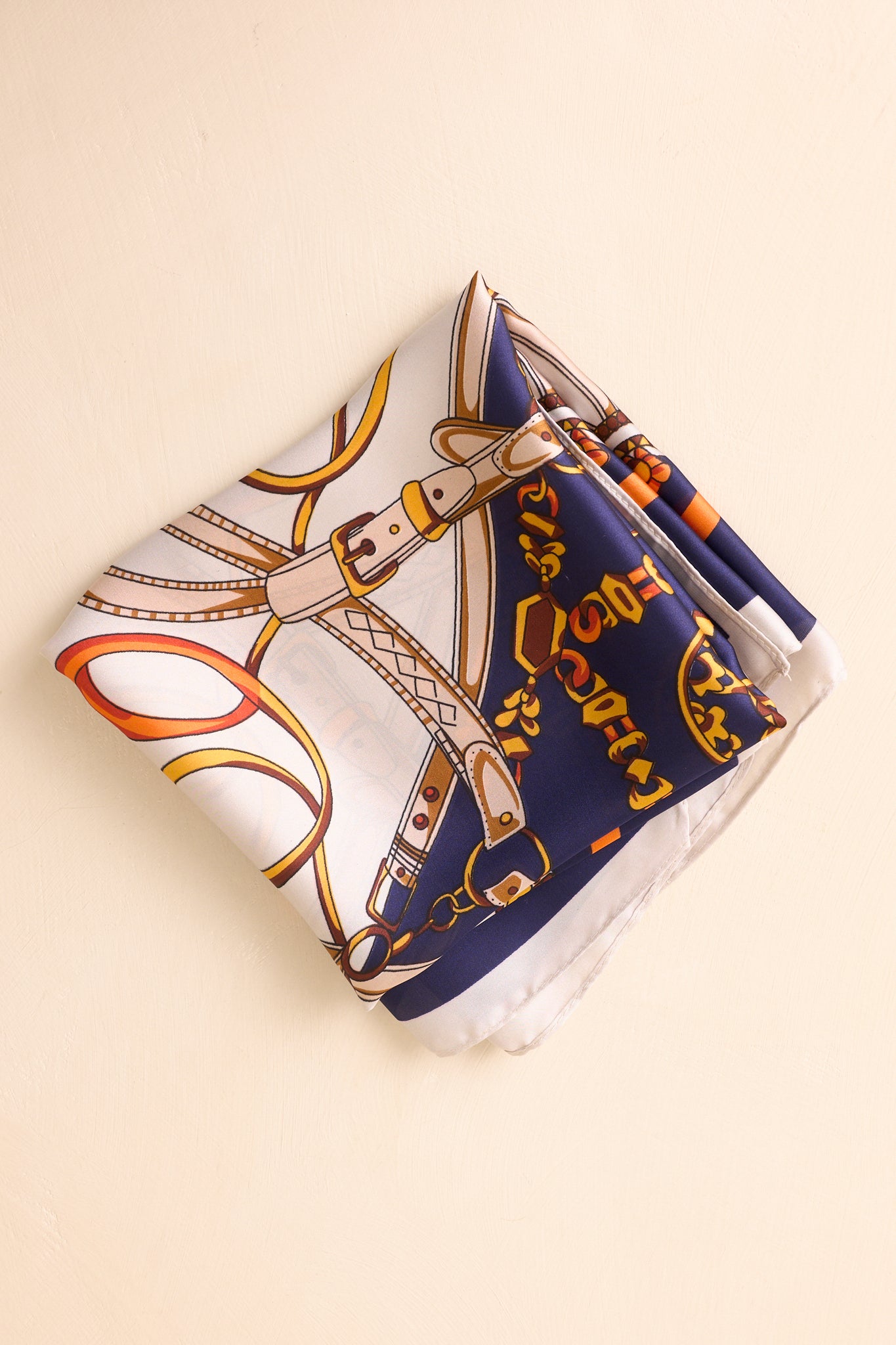 Front-facing image of the scarf, highlighting the intricate chain and tassel design and border detailing.