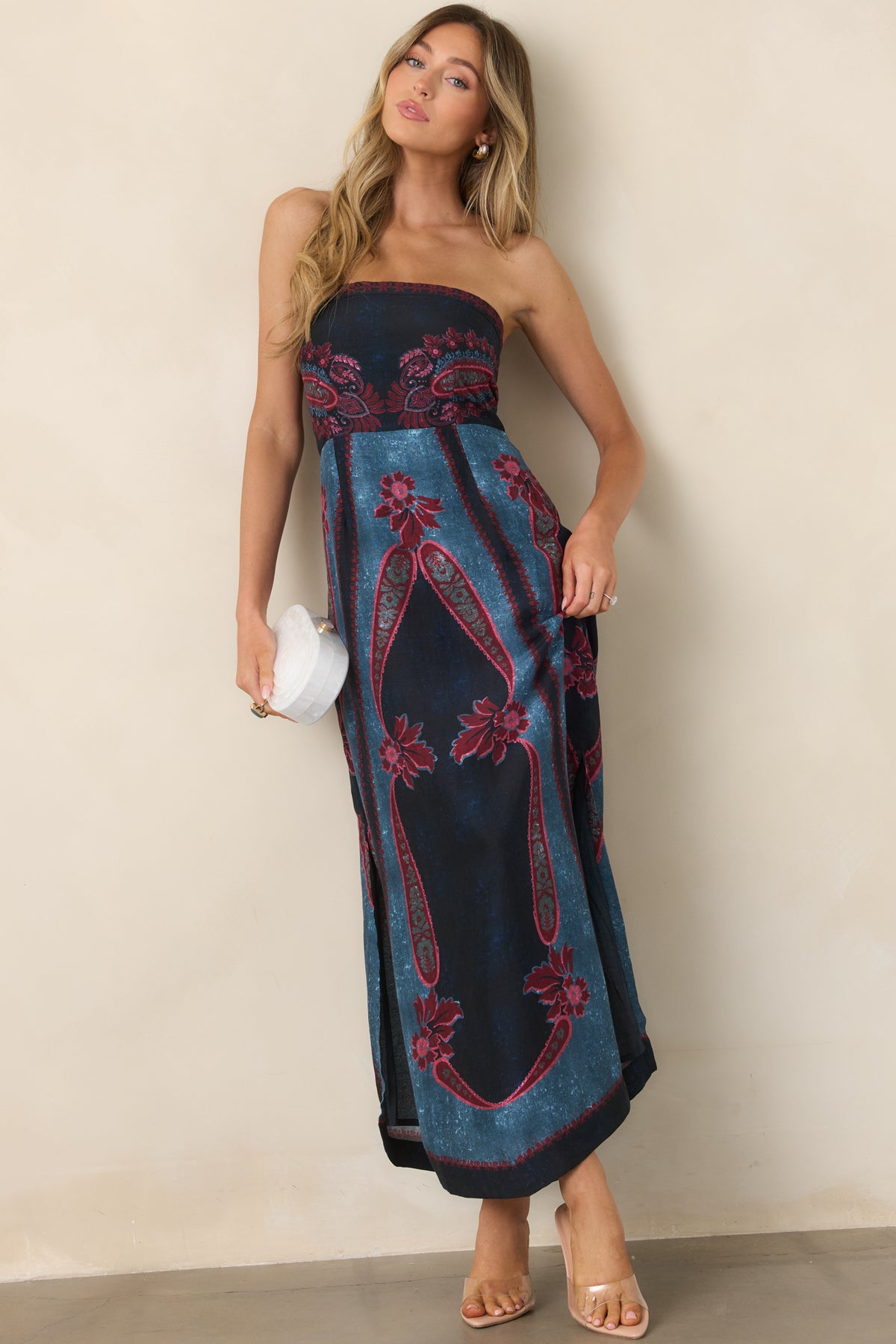 Scarf-inspired strapless dress combining burgundy paisley florals with deep navy and teal sections and a side-slit skirt.