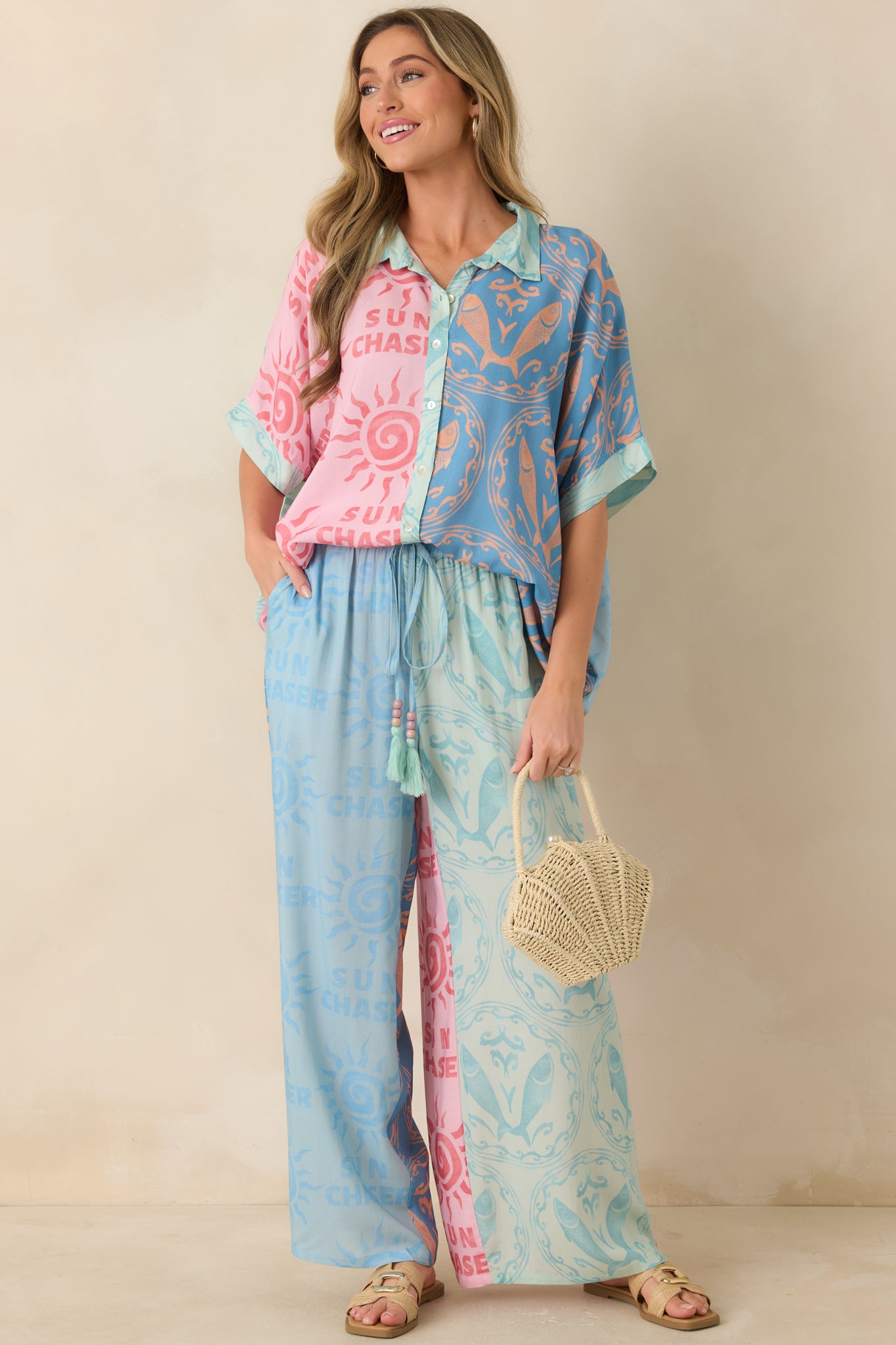 Sea-inspired wide leg pants with vibrant patterns, adjustable drawstring waistband, and a soft flowing drape.