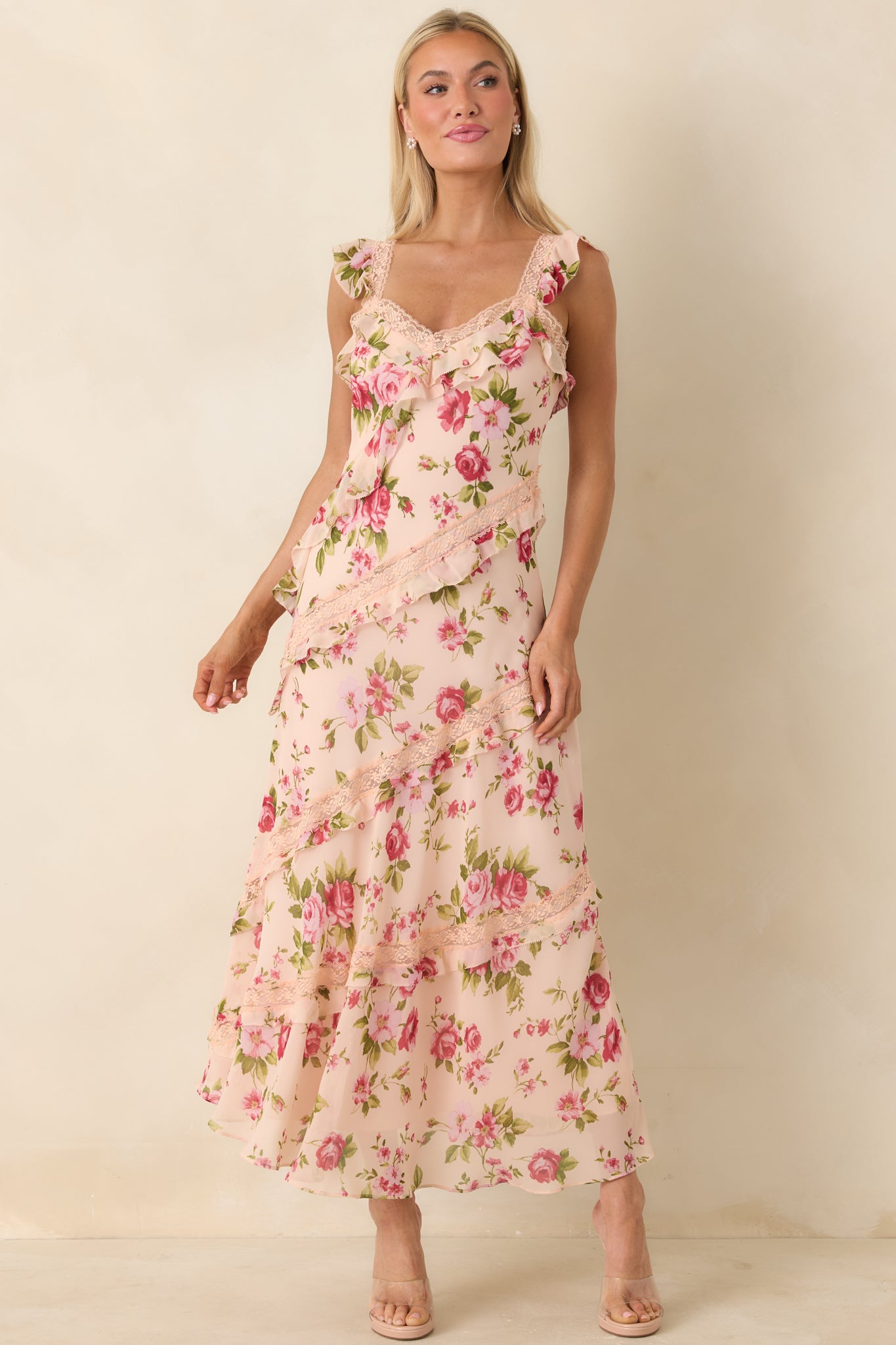 Semi-sheer midi dress with diagonal ruffle accents, lace trim, and a flowing, airy silhouette.
